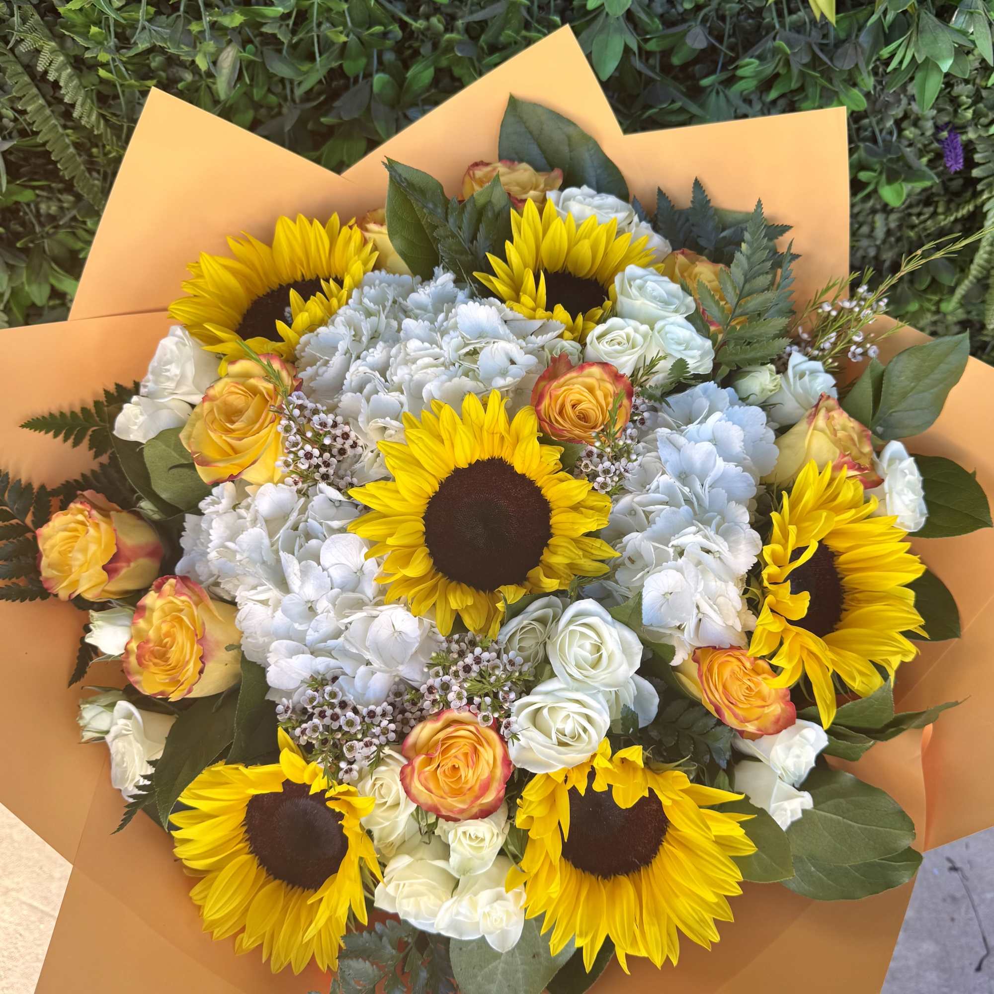 A bright and joyful bouquet featuring sunflowers, symbolizing warmth, positivity, and happiness.