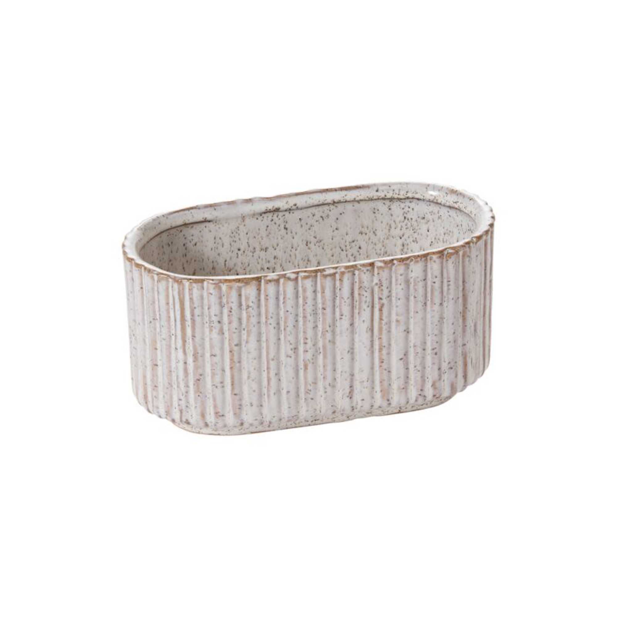 A collection of ribbed ceramic vessels with a soft ivory glaze and