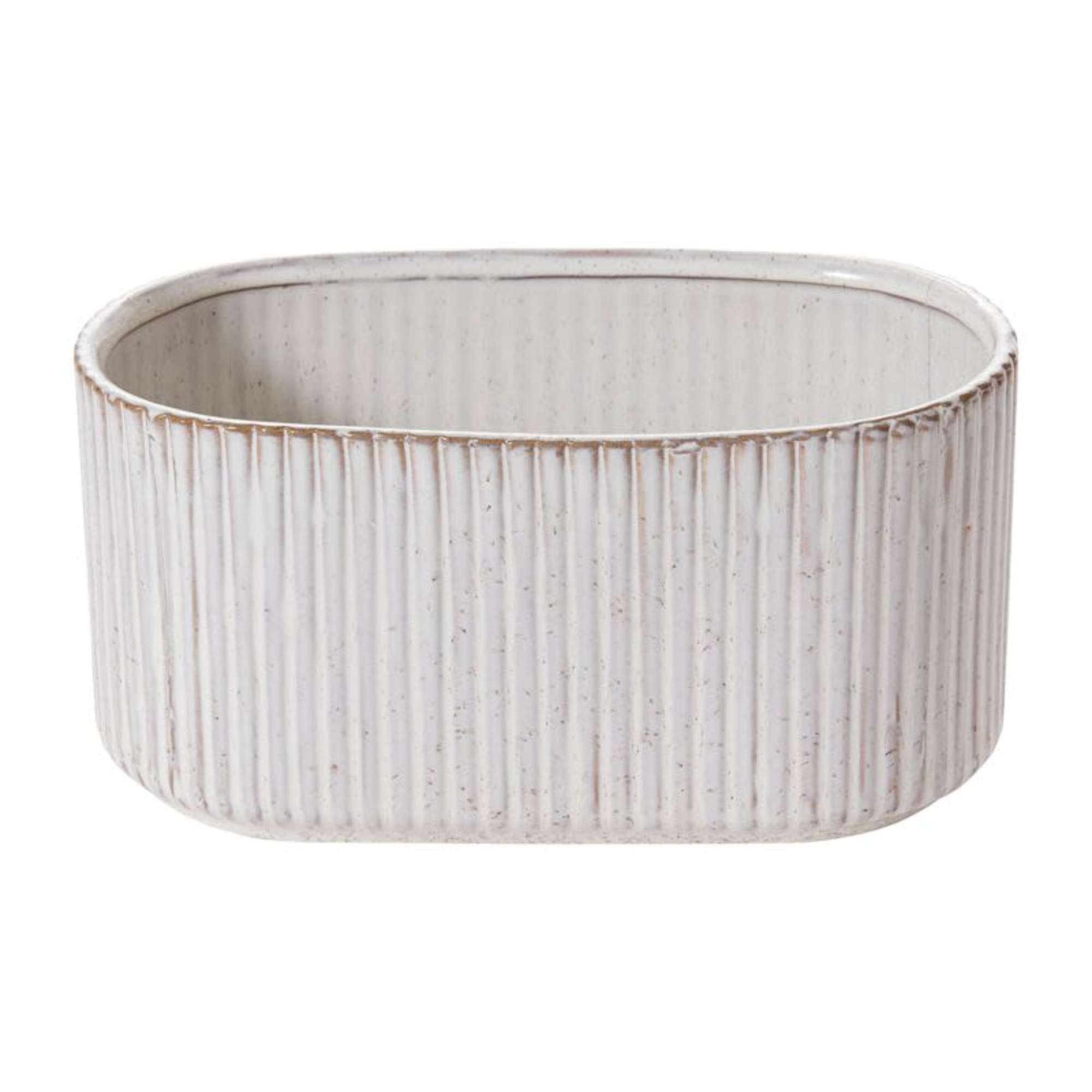 A collection of ribbed ceramic vessels with a soft ivory glaze and