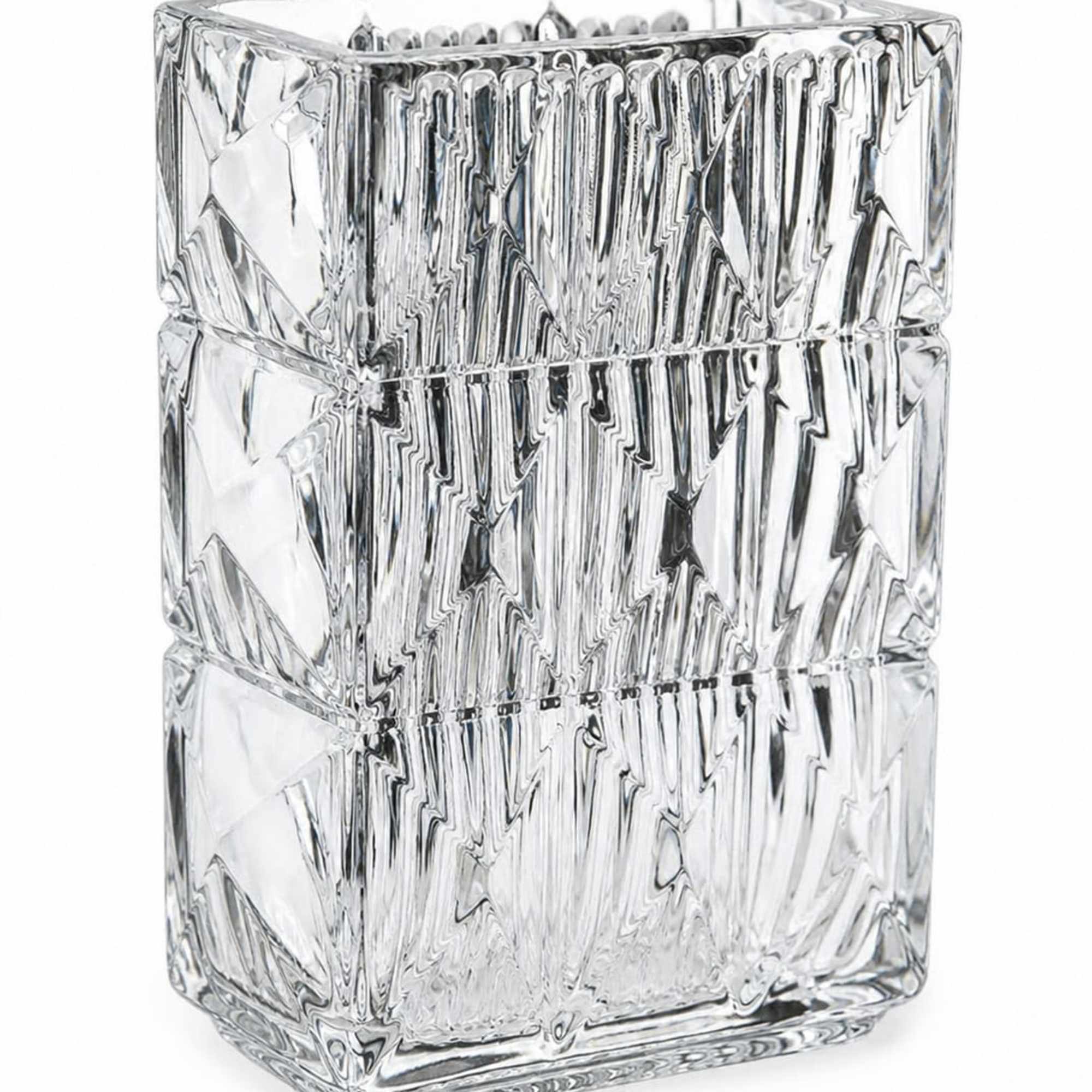 Clear faceted glass vase with geometric texture and heavy base giving a