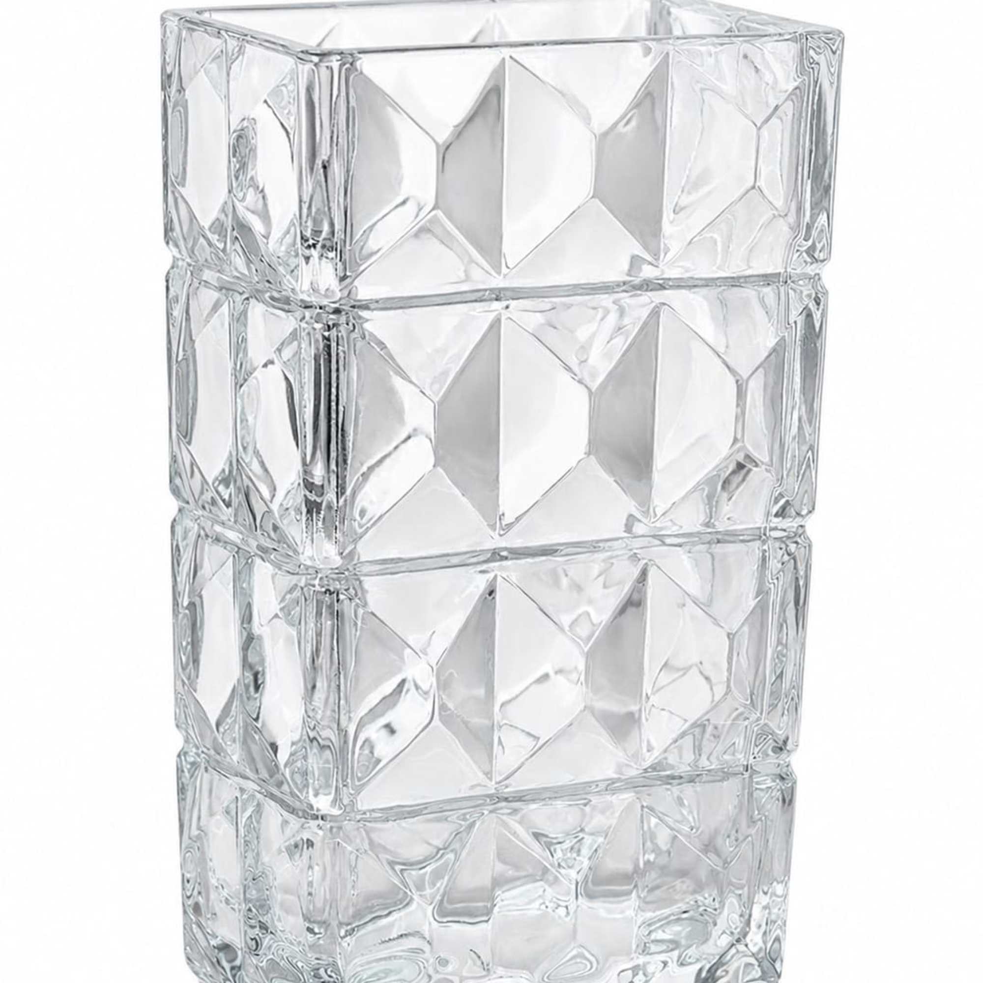 Clear faceted glass vase with geometric texture and heavy base giving a