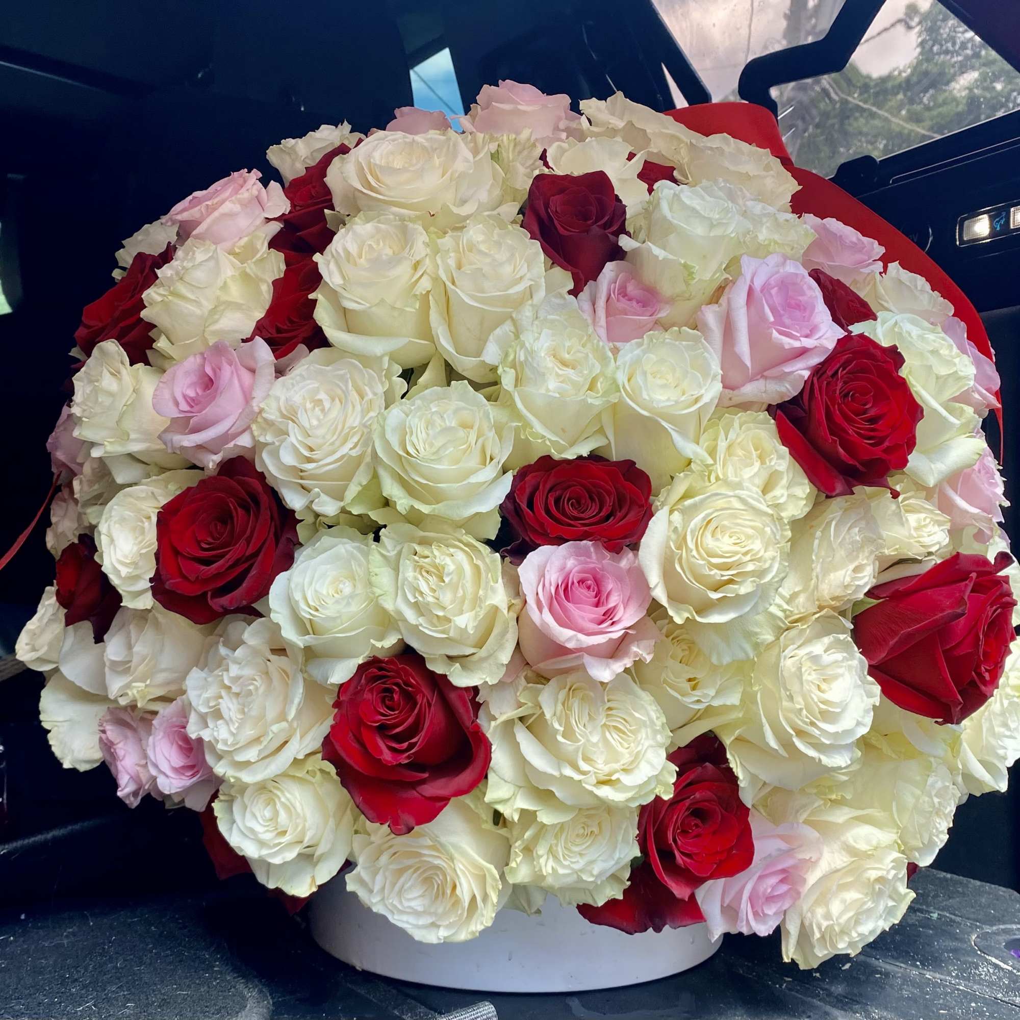 200 Red, Pink and White Roses in a large ceramic vase. 