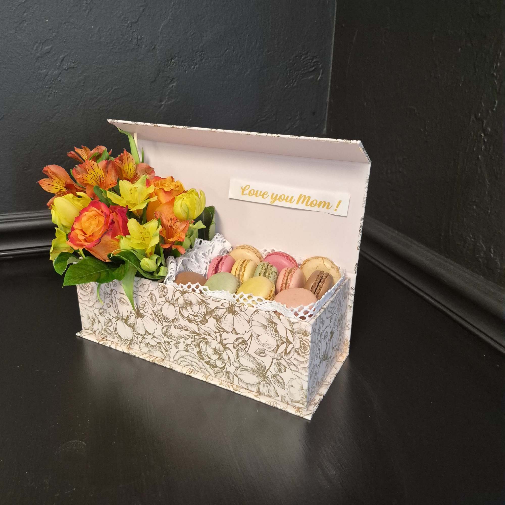 Bright clusters of orange roses paired with orange alstroemeria and yellow tulips, photo 2 of 2