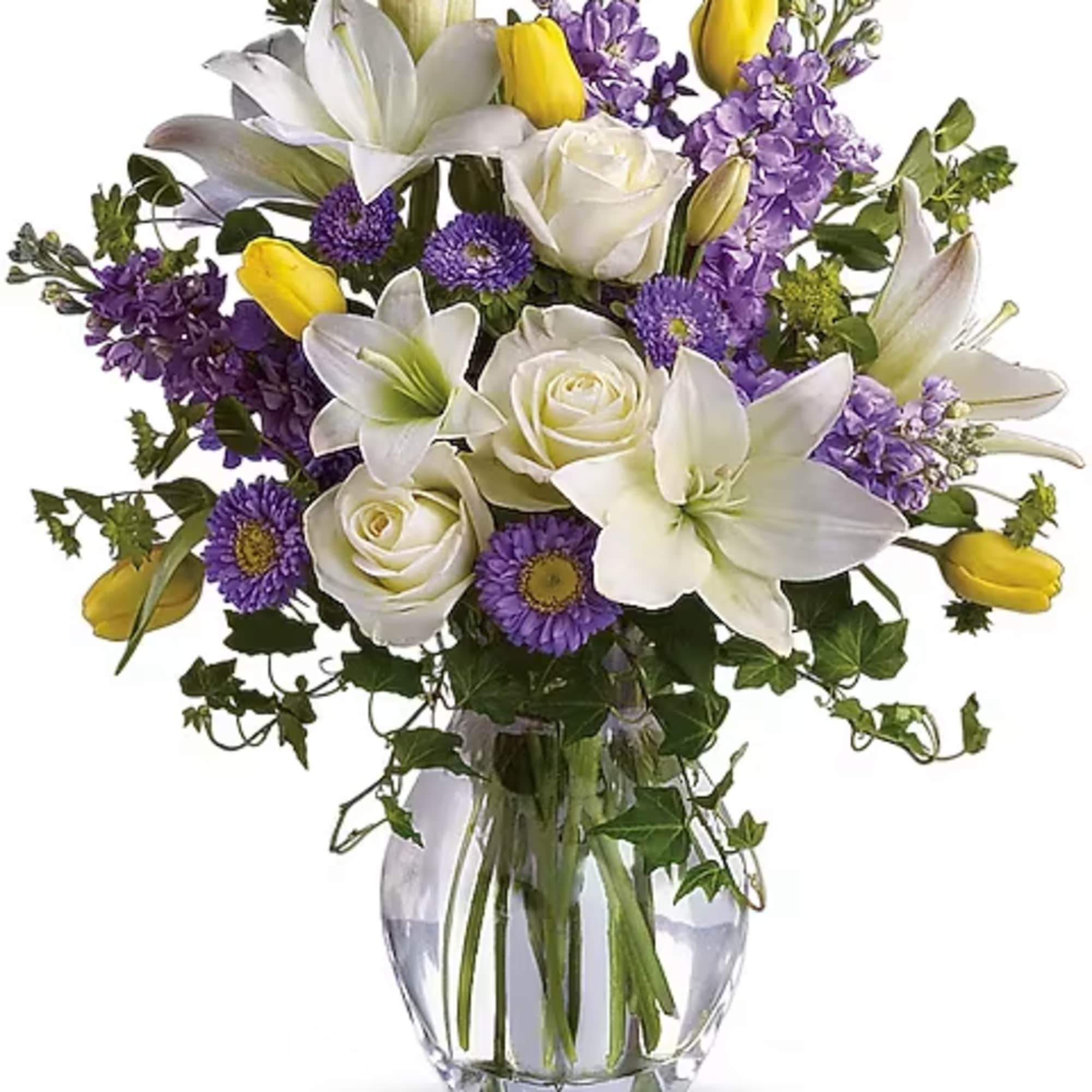 Graceful, elegant and timeless, this beautiful spring bouquet offers up colors, blossoms