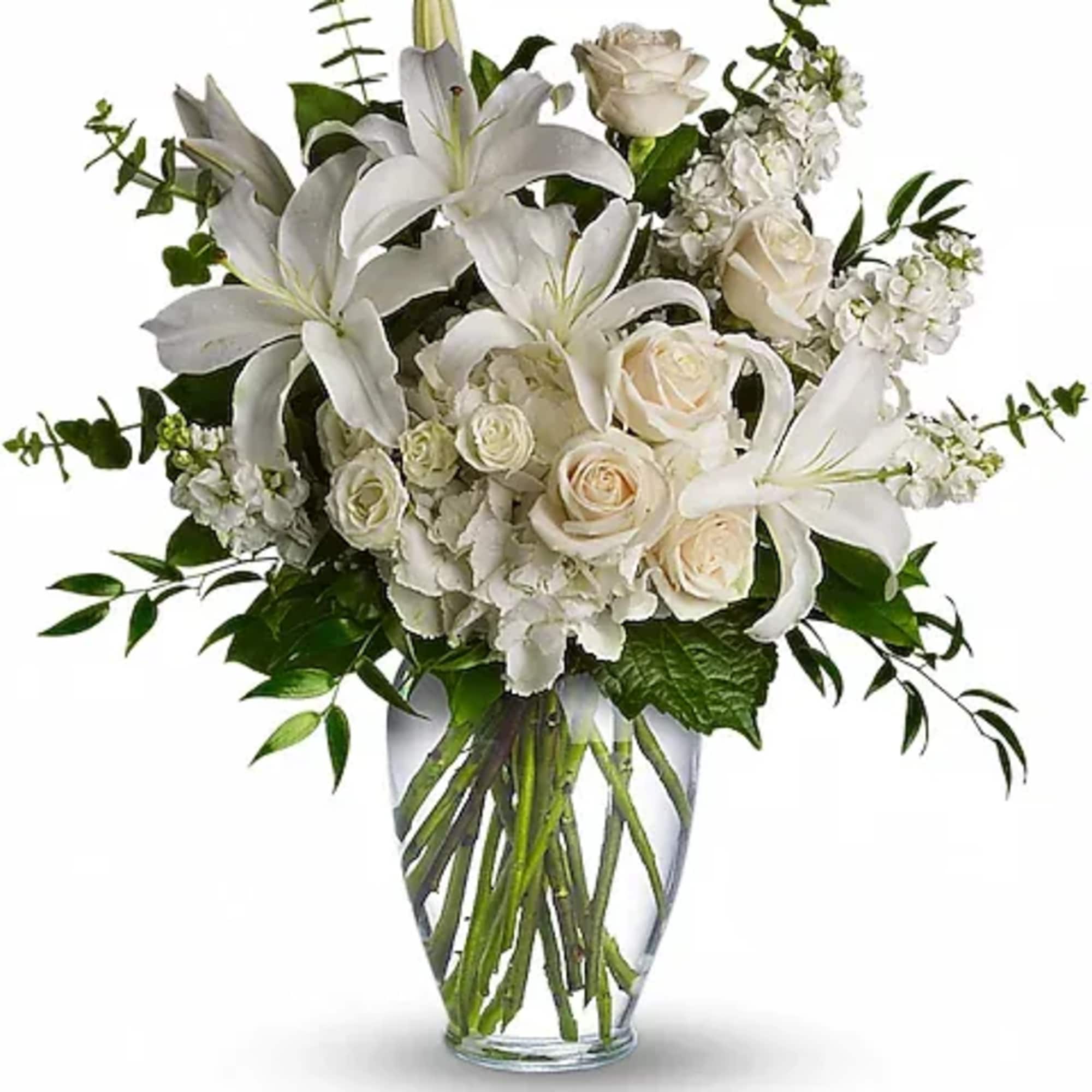 A lovely bouquet to soothe and comfort, a variety of white and