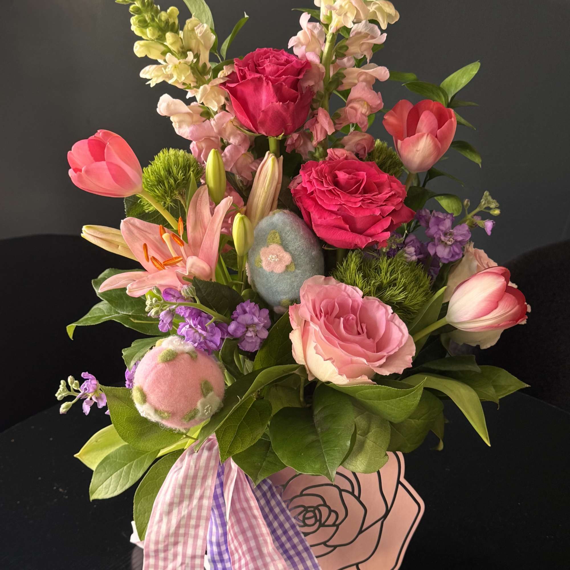 Easter Garden Delight is a vibrant spring composition designed to celebrate the