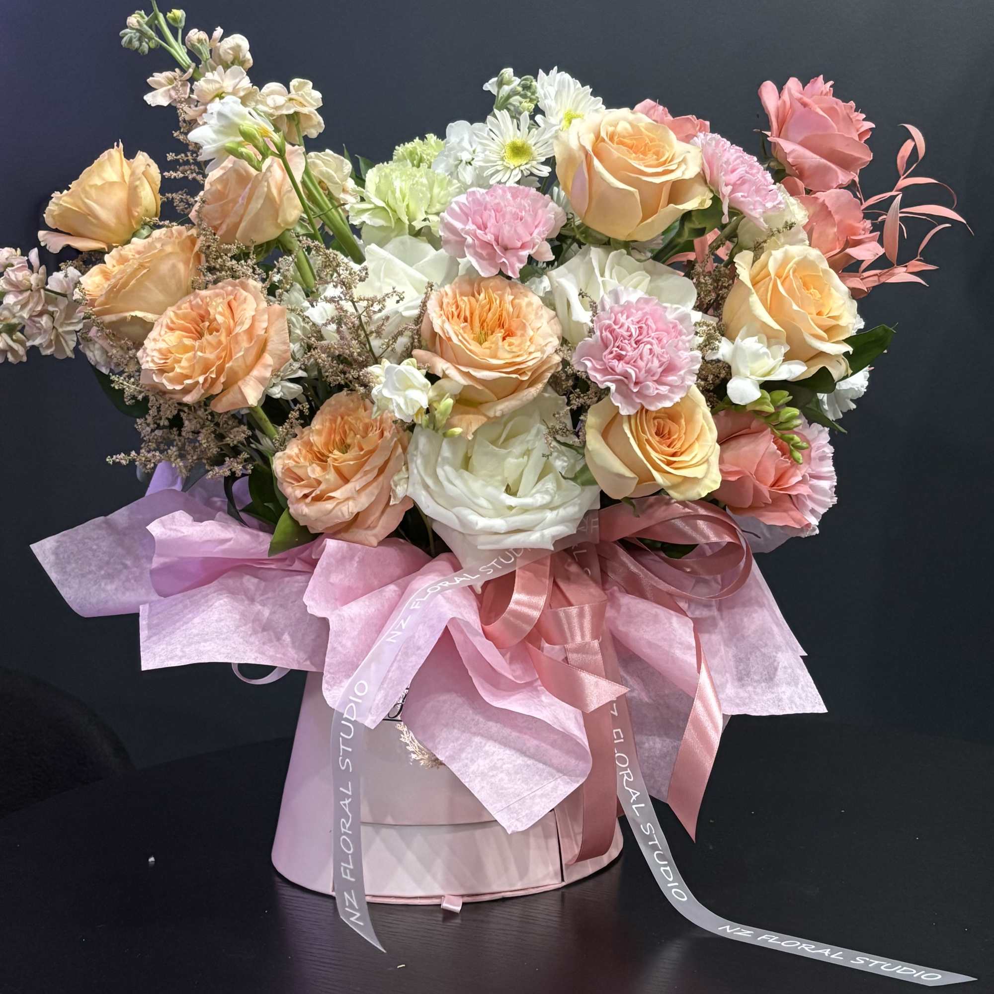 Blush Garden is a delicate, garden-inspired arrangement designed in soft pastel tones