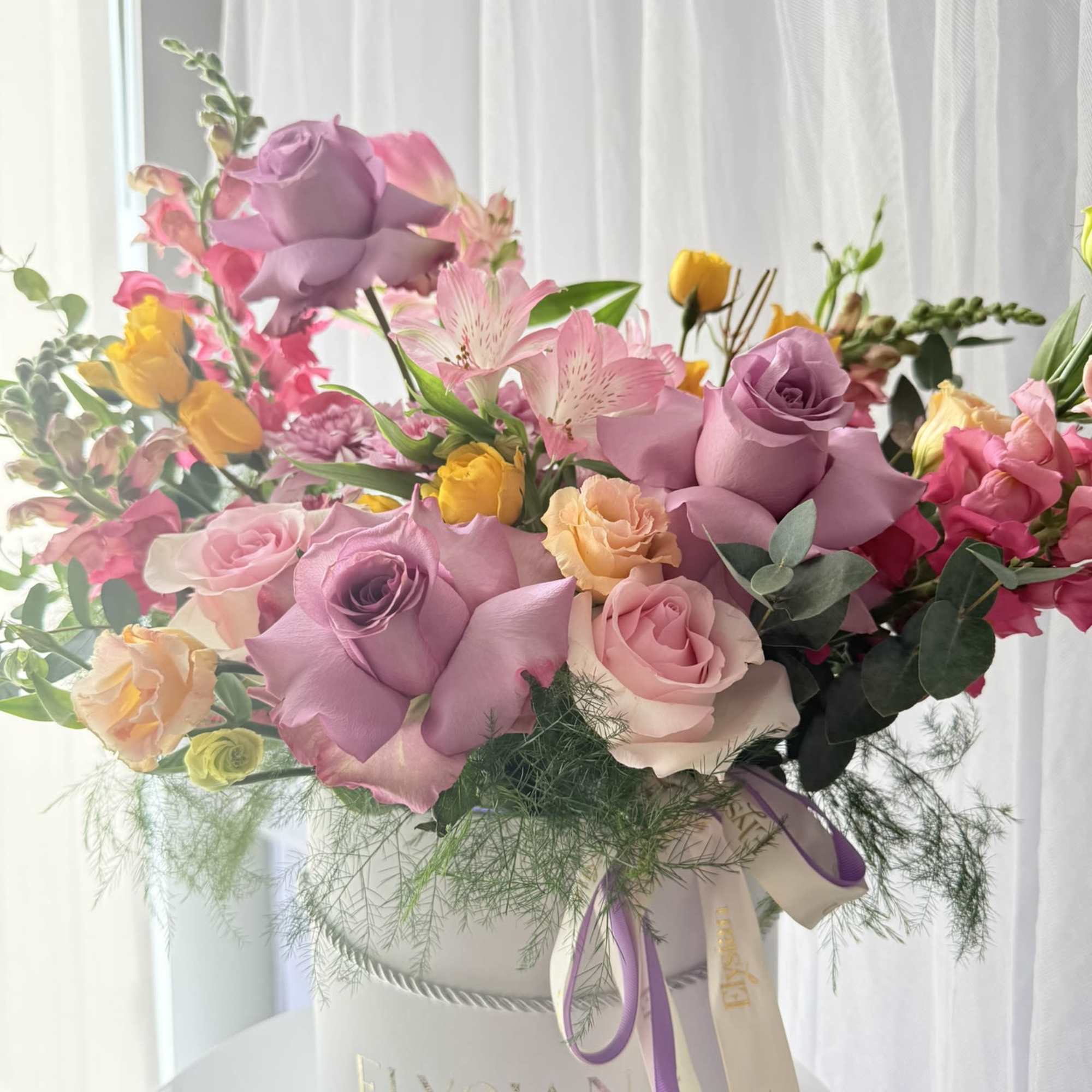 A joyful blend of color, texture, and movement &mdash; this garden-inspired arrangement
