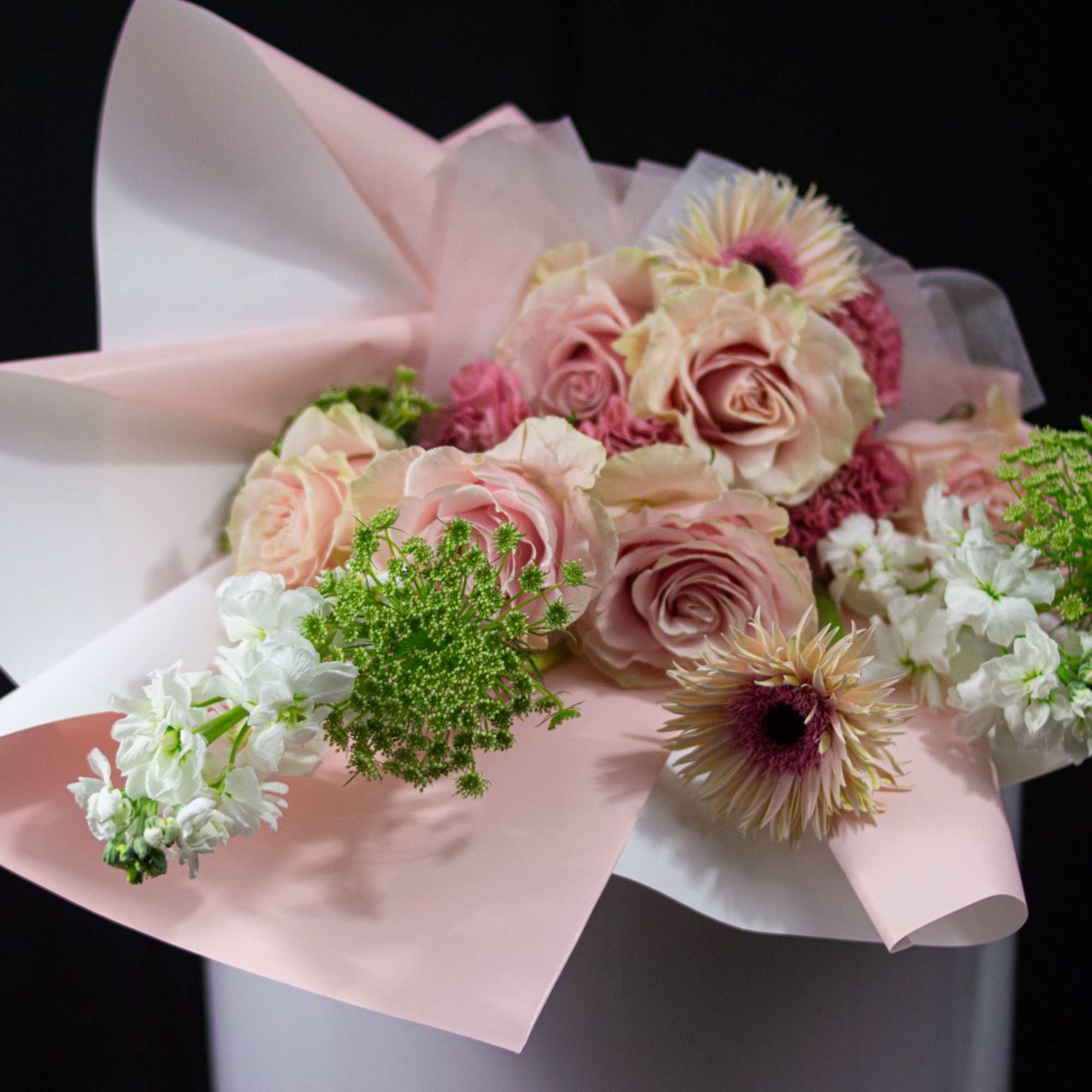 A soft expression of love, redefined. This arrangement features blush and nude