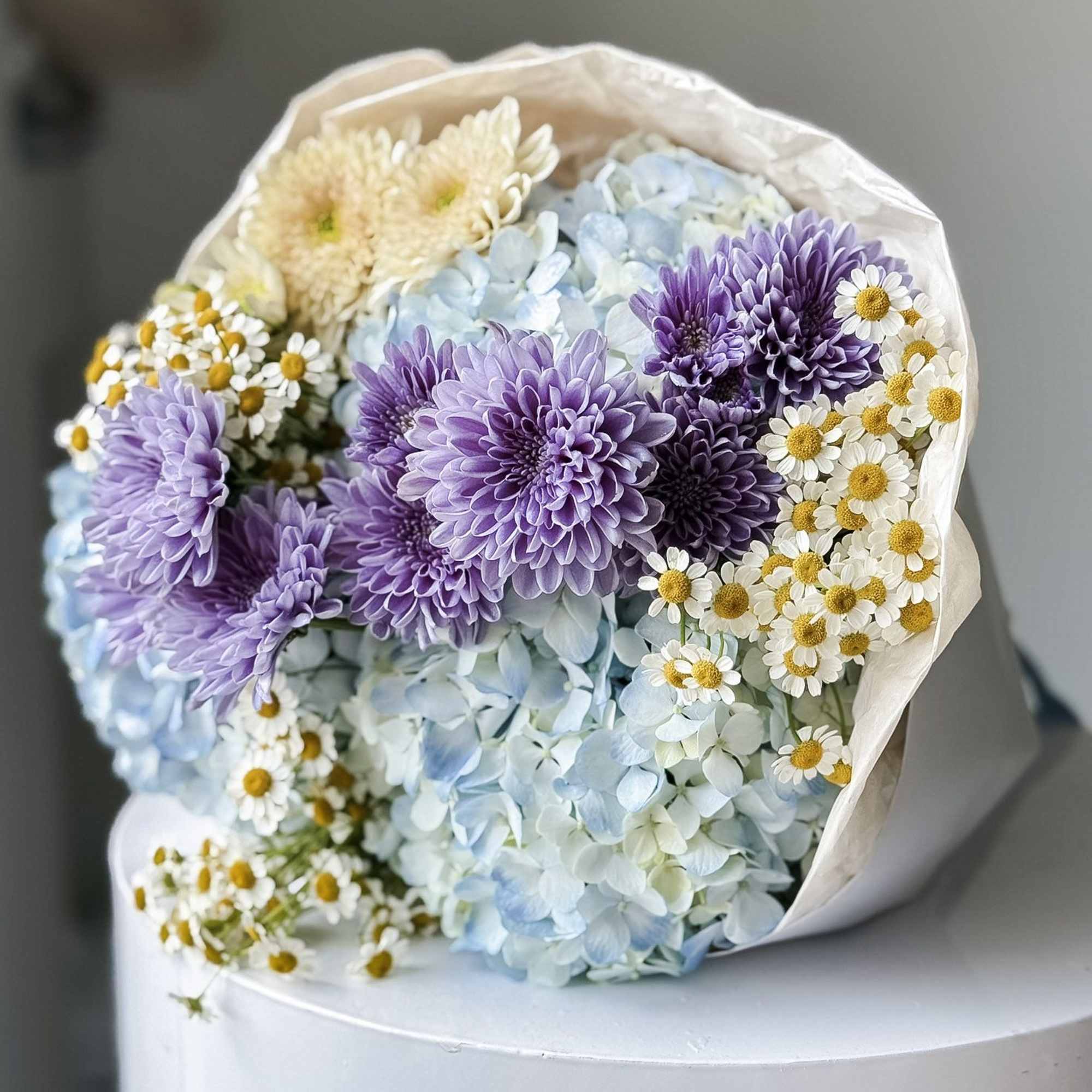 This stunning creation is designed to capture hearts. This round arrangement showcases