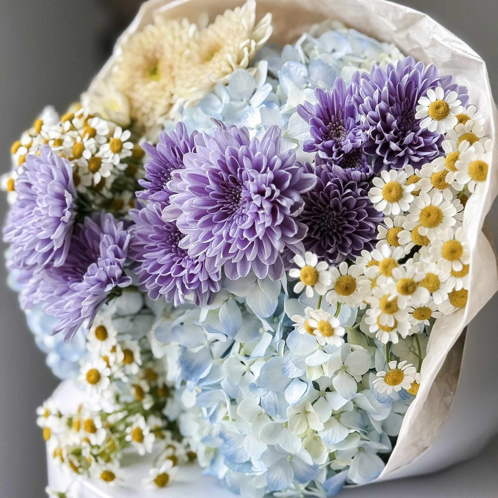 This stunning creation is designed to capture hearts. This round arrangement showcases