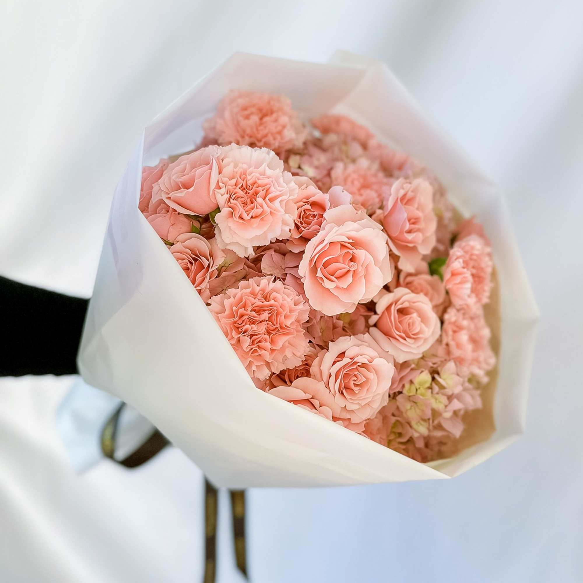 Our best-selling creation is designed to capture hearts. This round arrangement showcases
