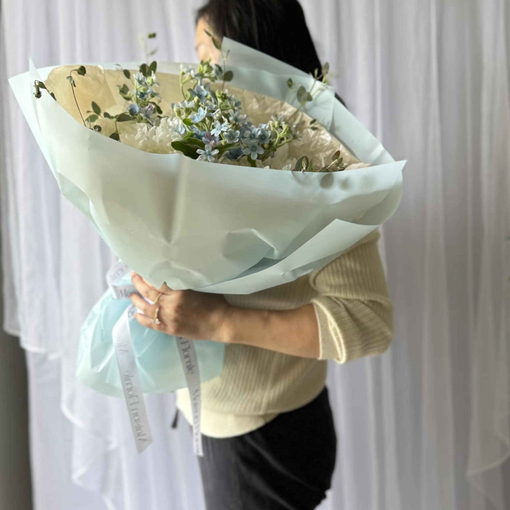 A soft and dreamy bouquet featuring lush white disbud chrysanthemums accented with, photo 2 of 2