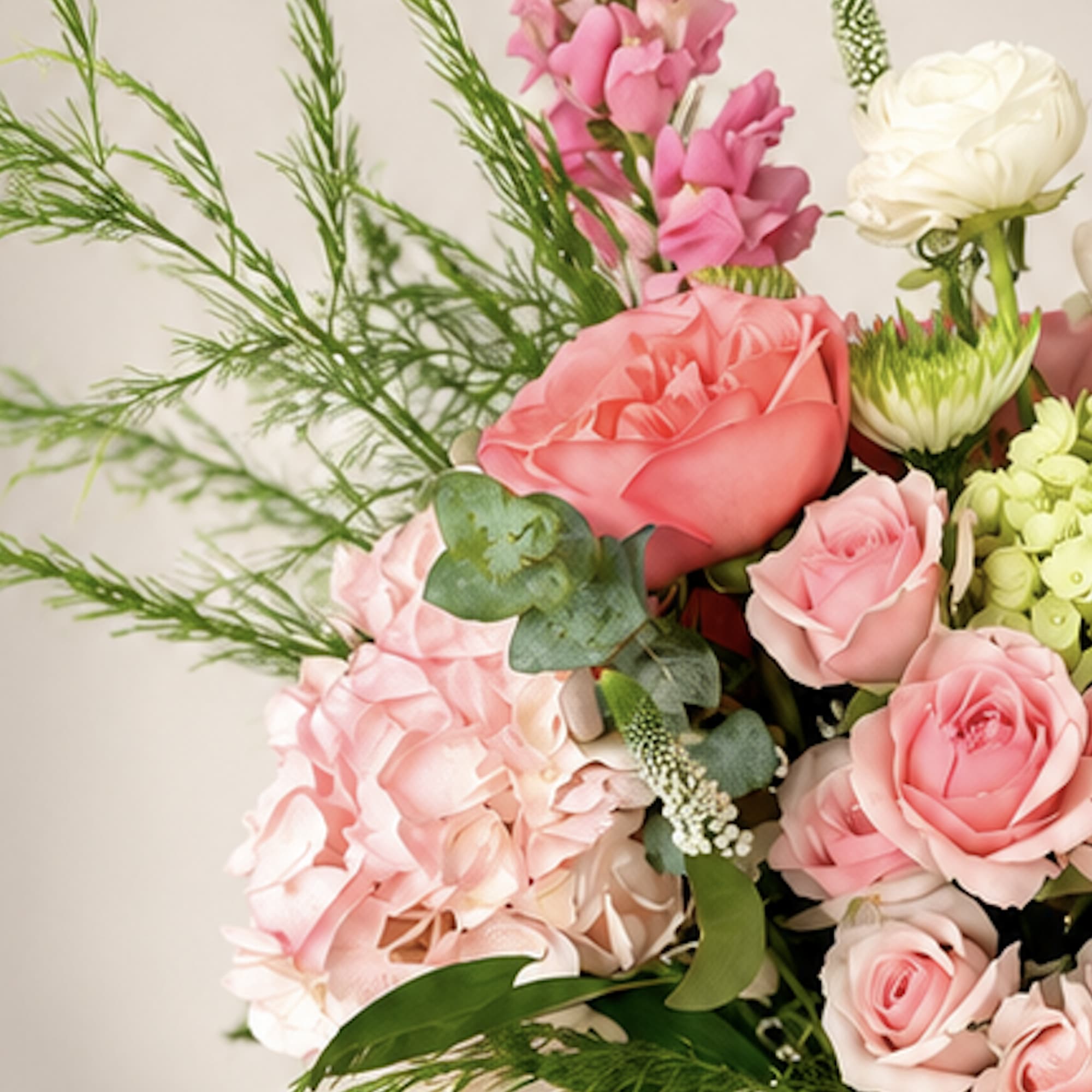 Pink and white rose bouquet with hydrangea and greenery