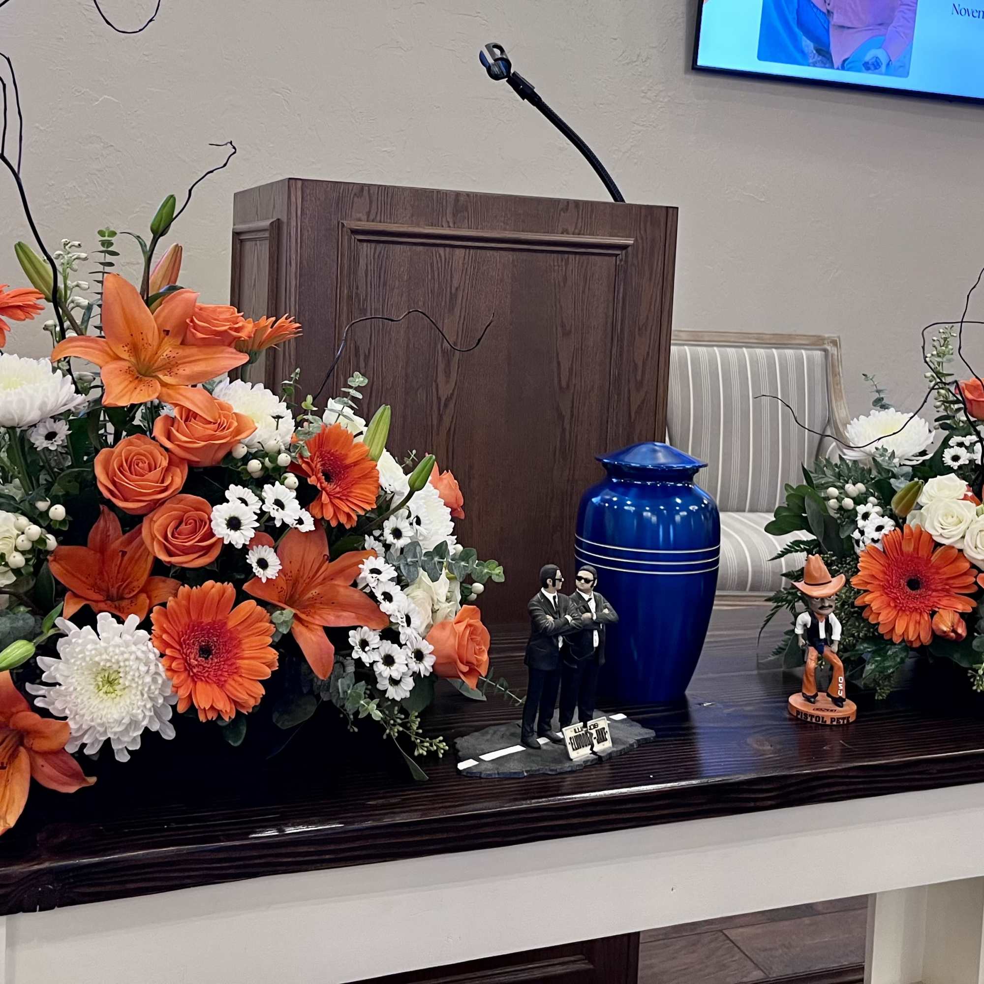 Bright, energetic orange roses, lilies, and gerbera daisies mingle with crisp white, photo 2 of 2