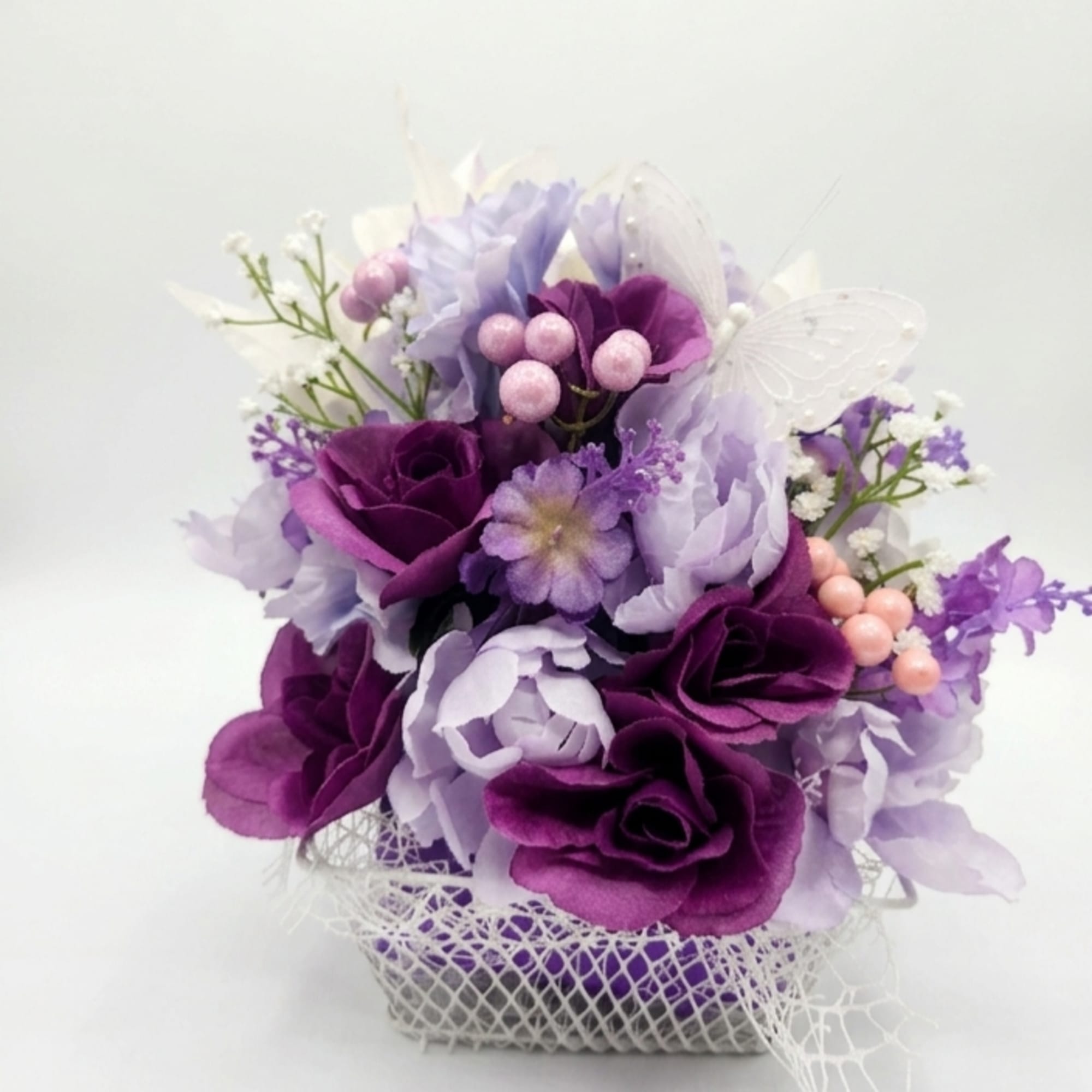 Soft satin-like roses and clustered blooms in purple, lavender, pink and white