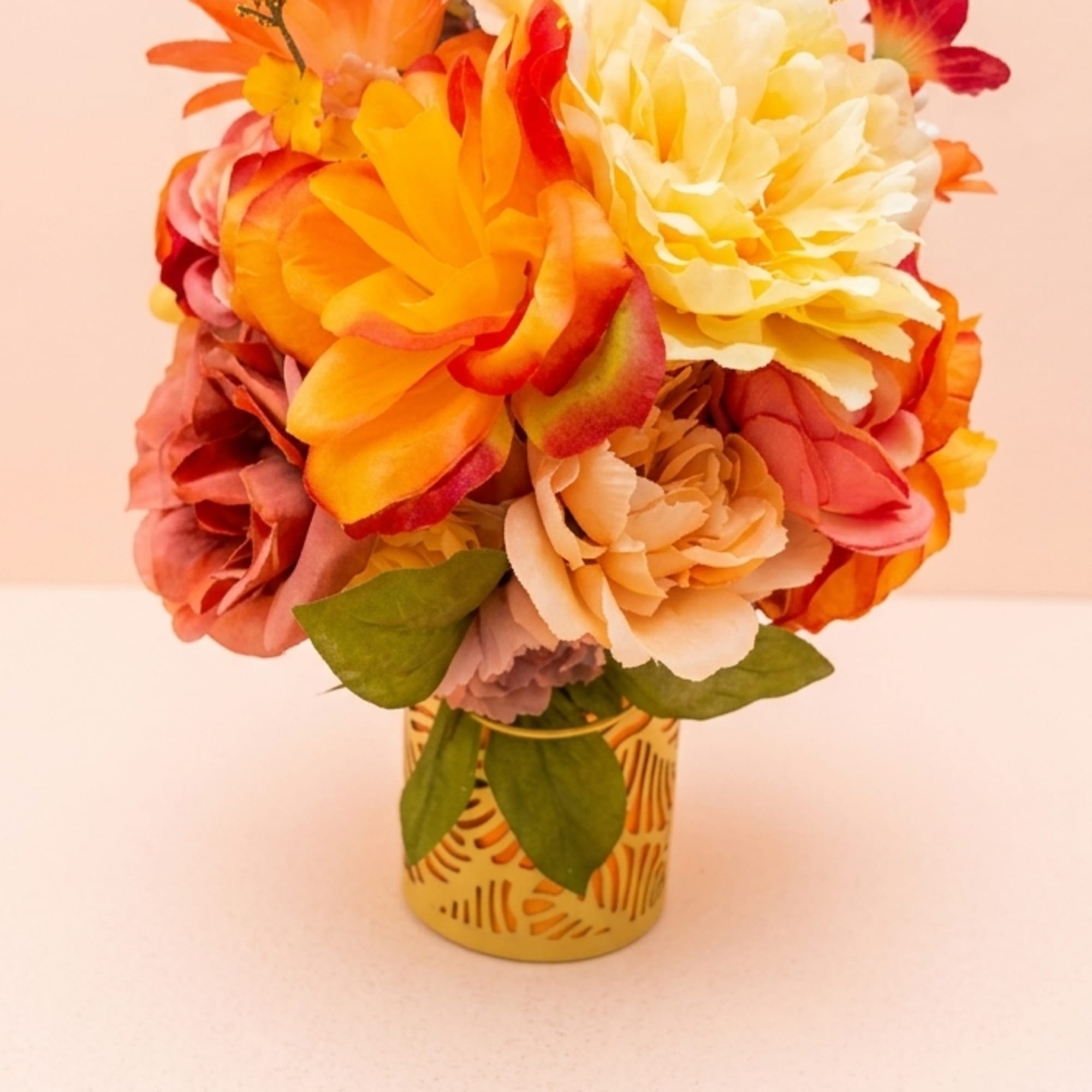 Sun-drenched citrus slices mingle with vibrant marigolds and yellow roses to create