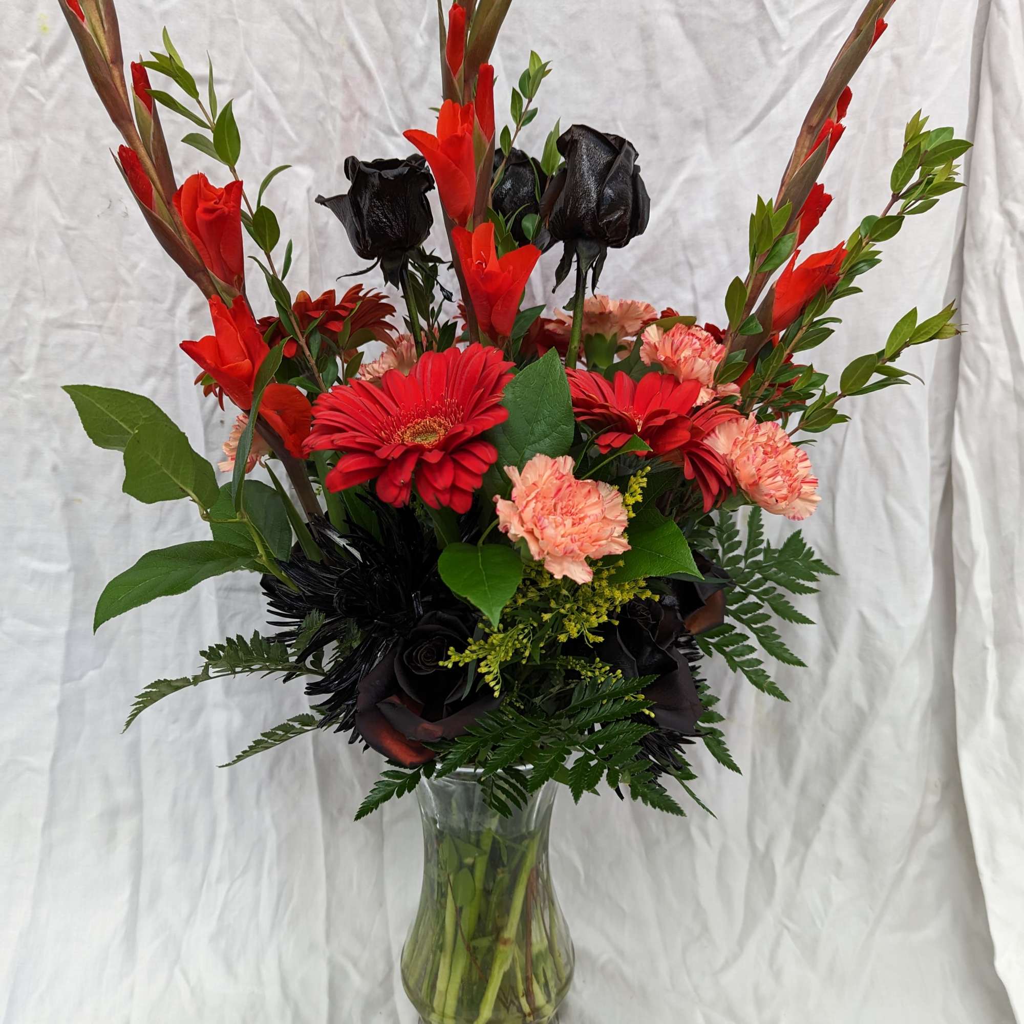 Orange and black flowers were requested for a Harley Davidson member's memorial