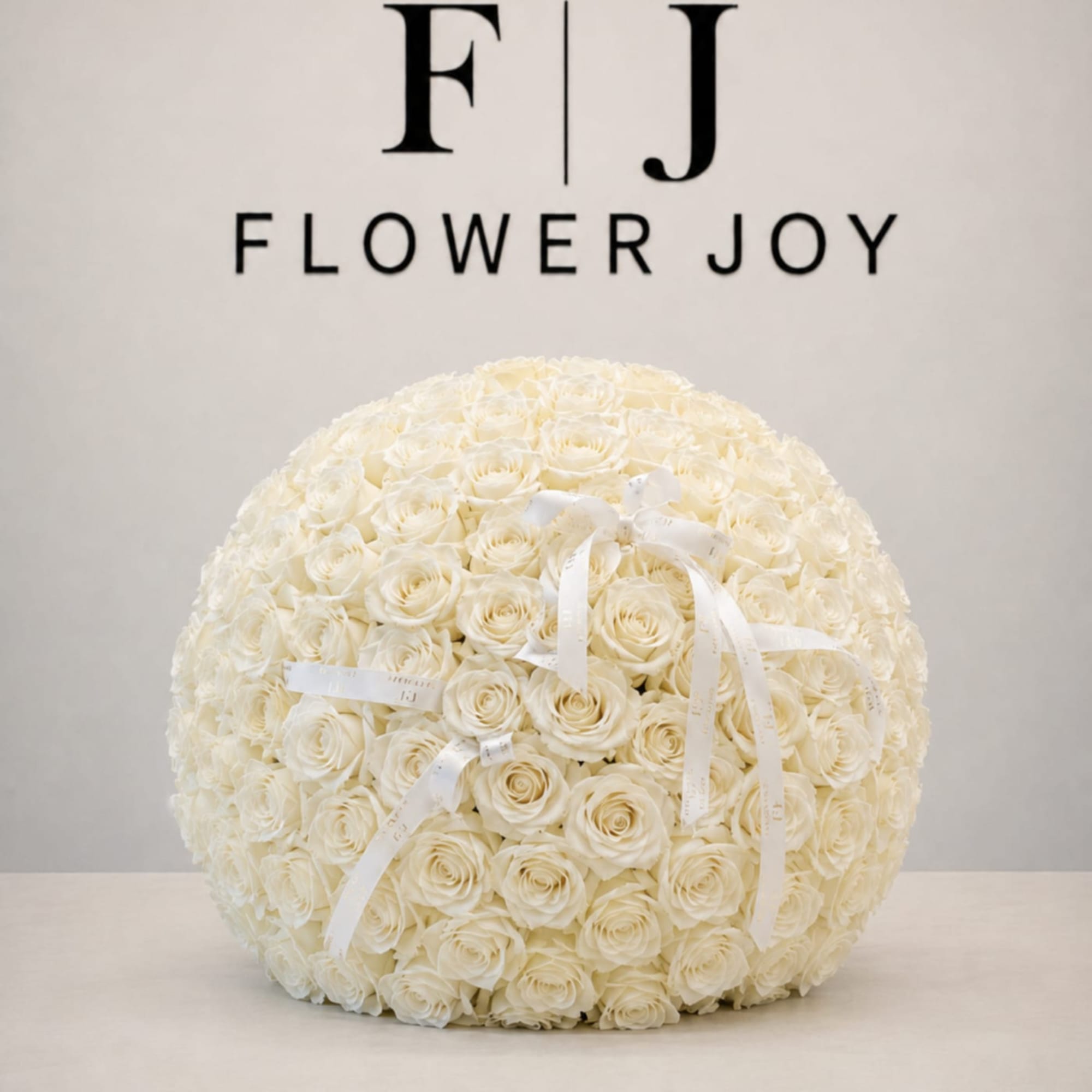 An abundant arrangement of white roses, designed to make every celebration feel