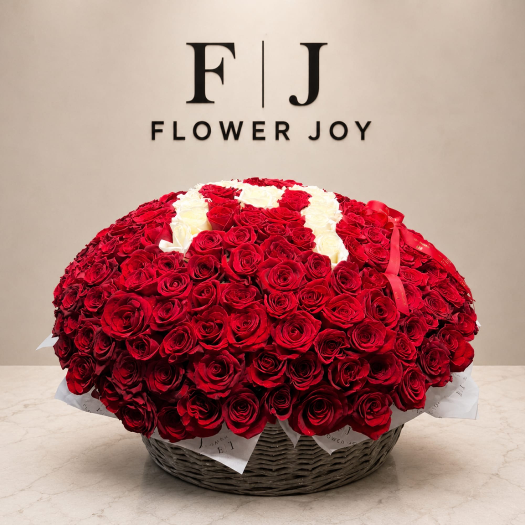 Large basket of red and white roses with a ribbon