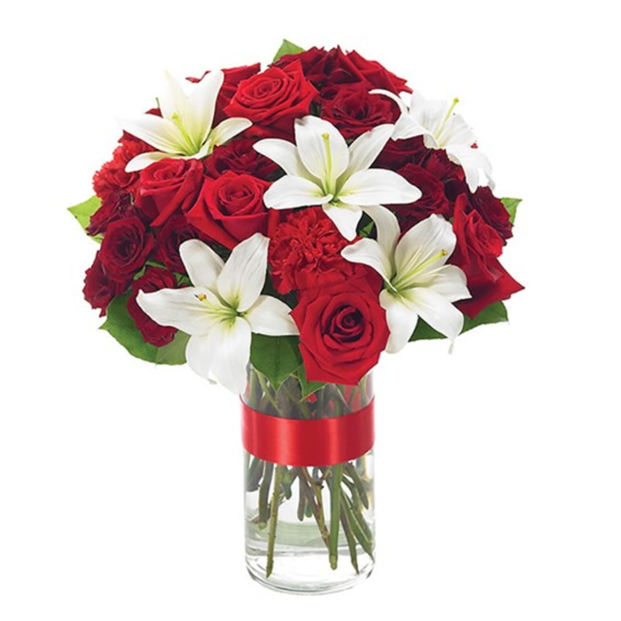 Red roses and white lilies in a clear glass vase with a red ribbon