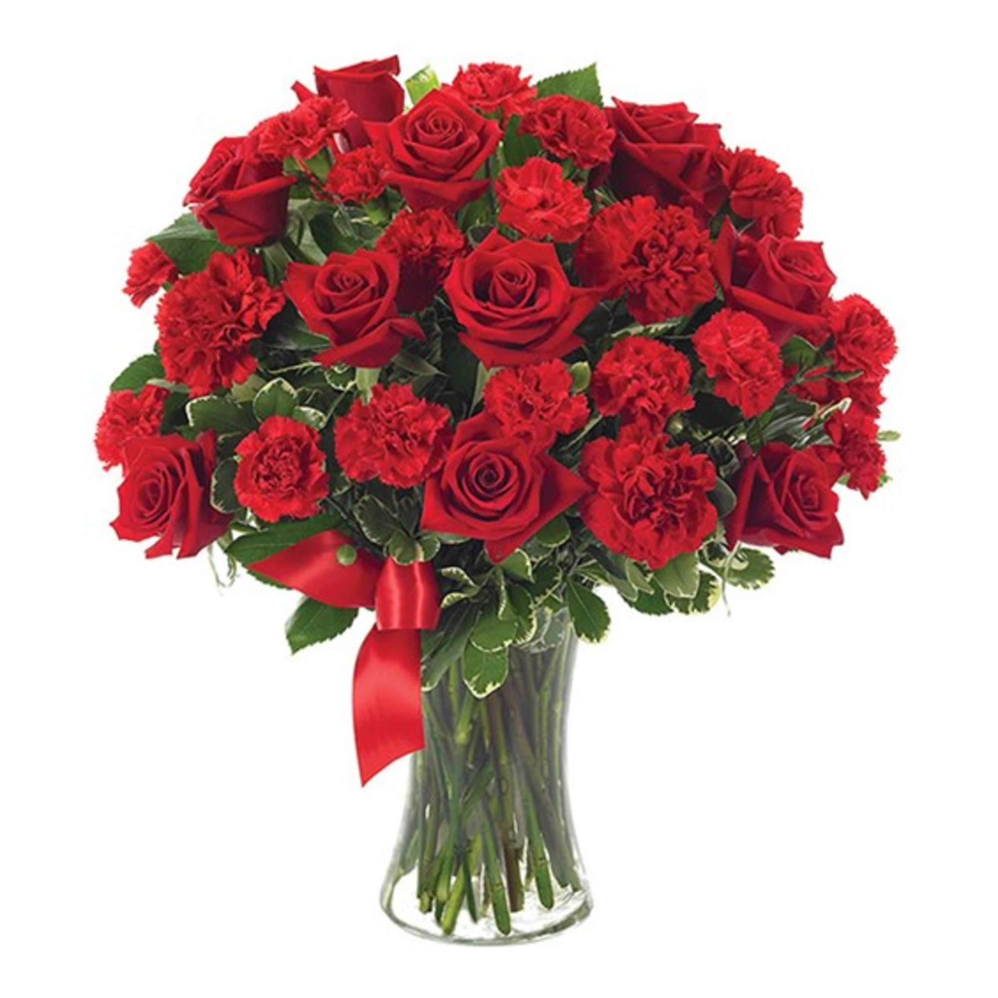 Red roses and carnations in a clear glass vase with a red ribbon