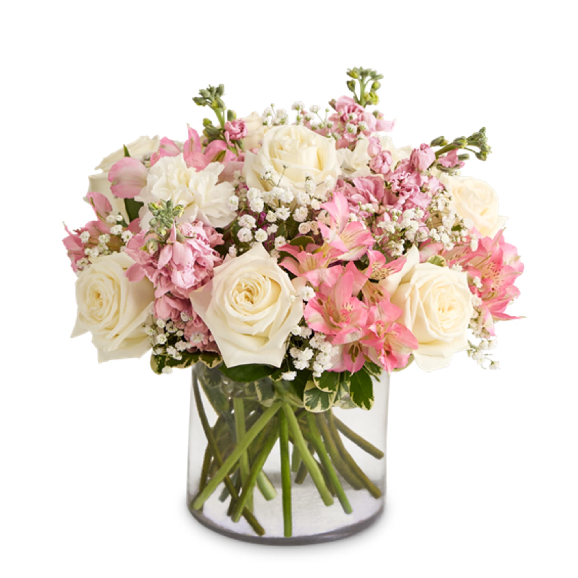 Pink and white rose bouquet in a clear glass vase