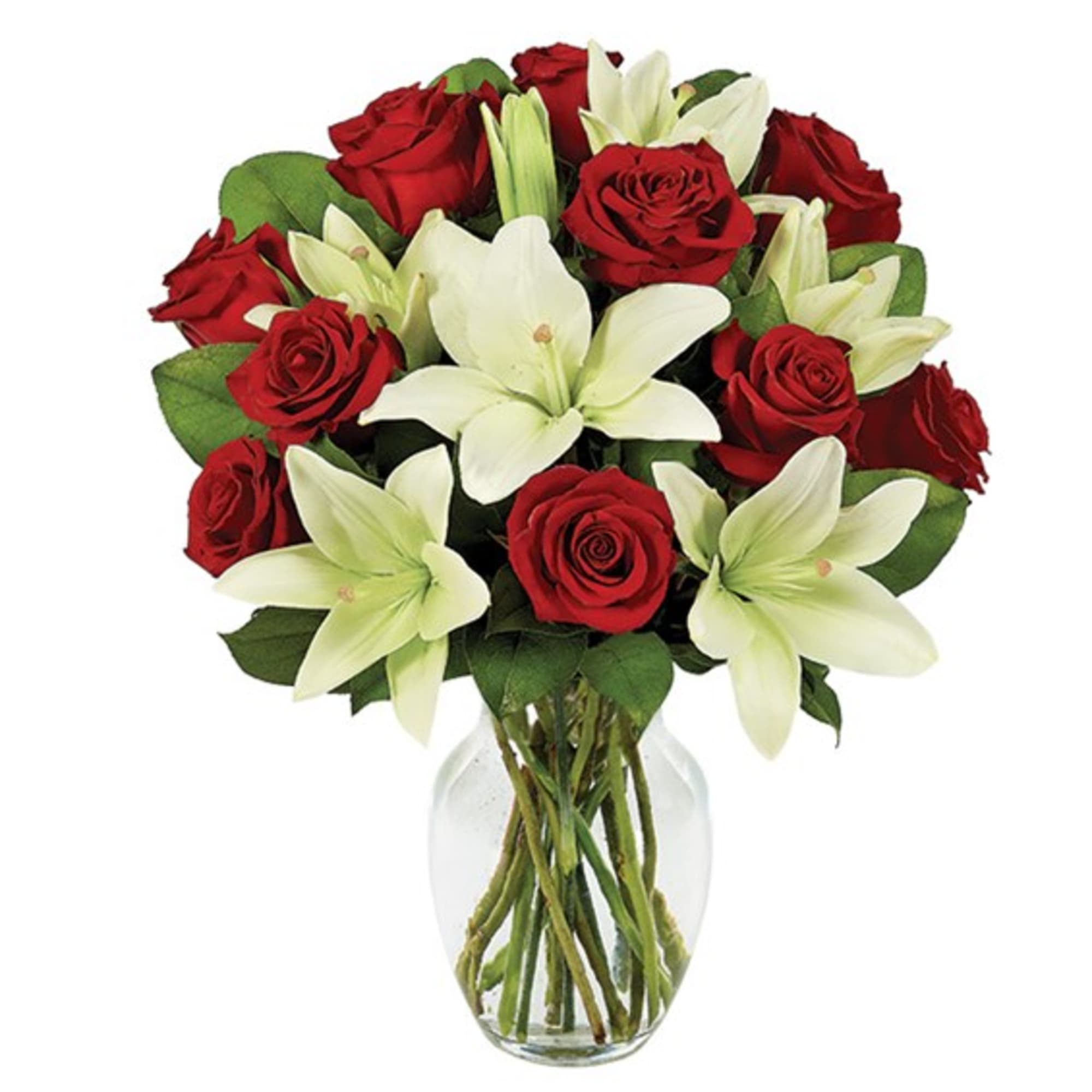 Red roses and white lilies arranged in a clear glass vase