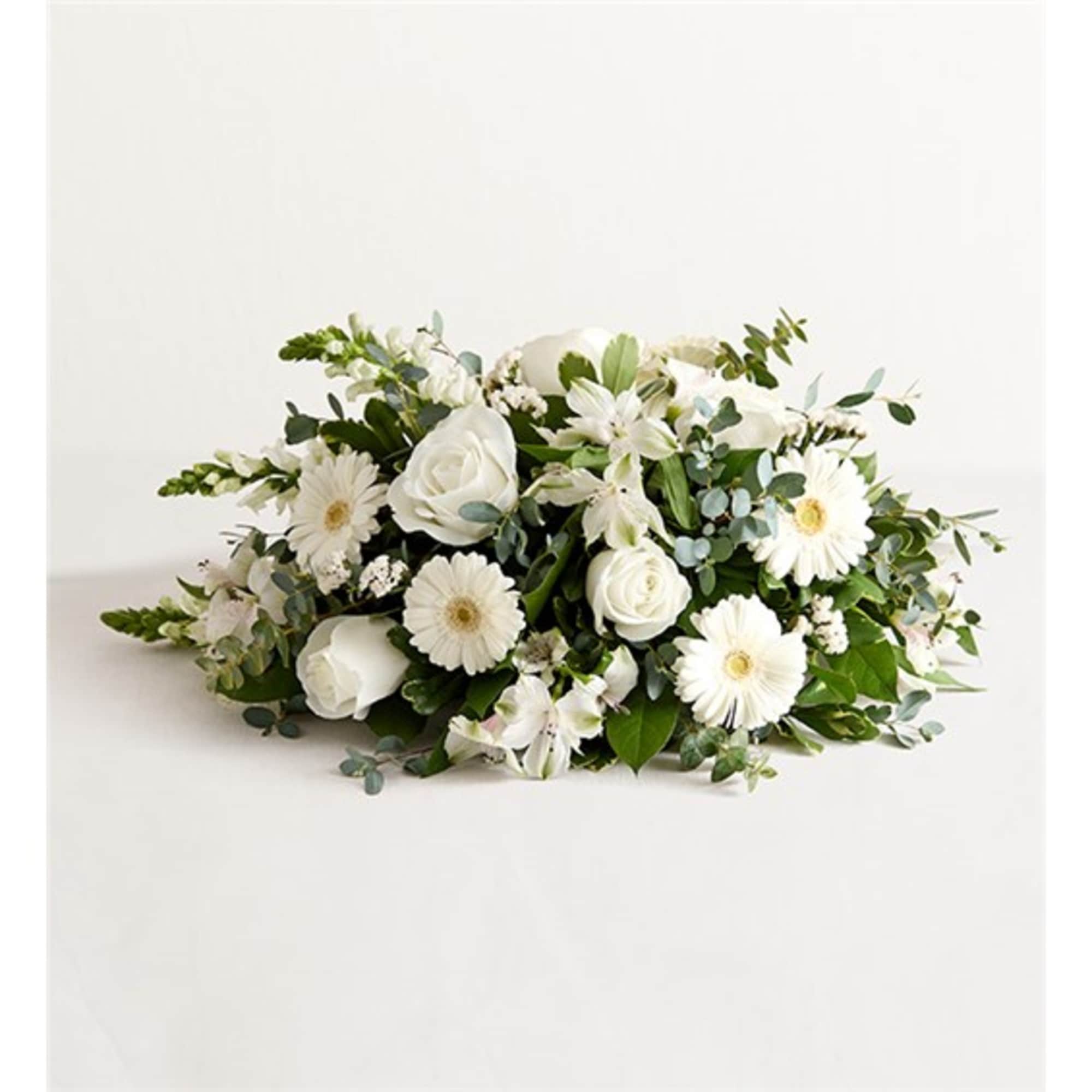White floral arrangement with roses and daisy-like blooms