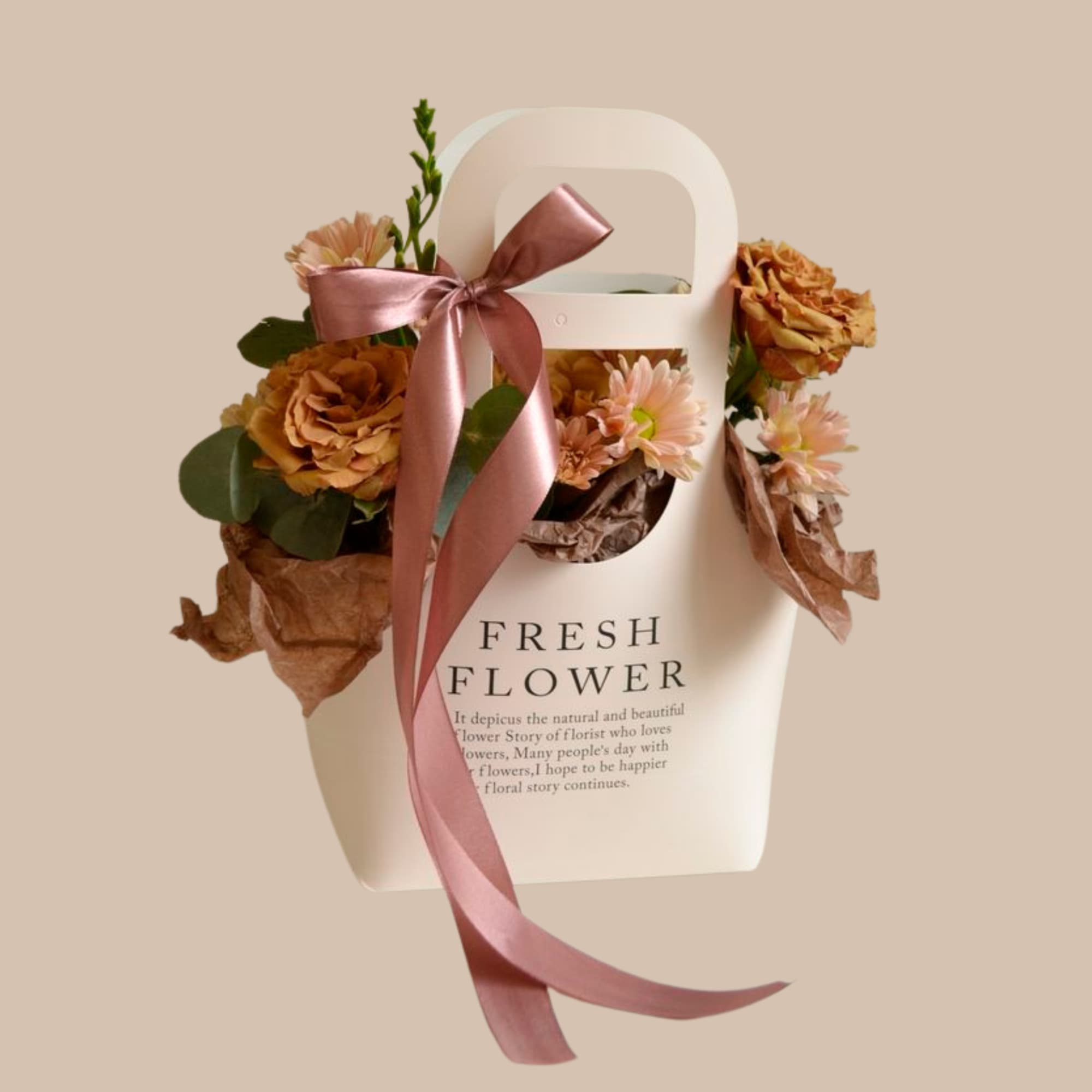 Mixed flower arranged around a kraft bag make this small floral carrier, photo 2 of 2