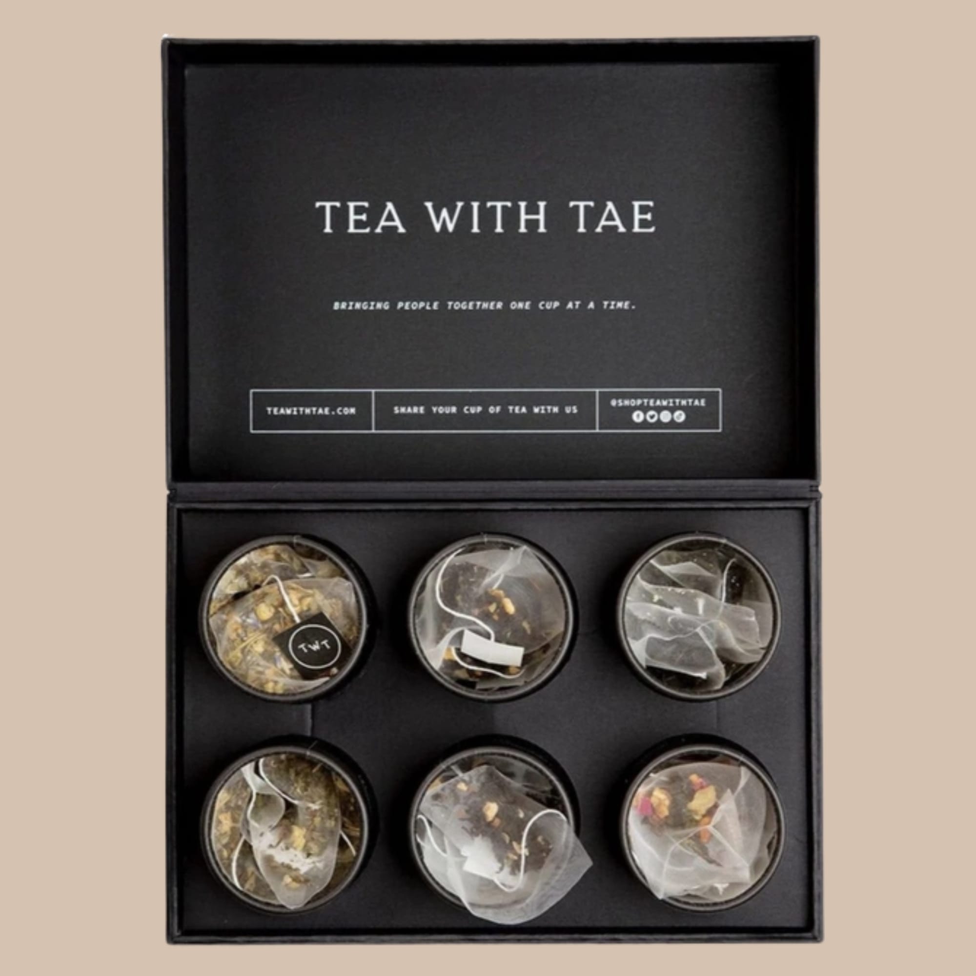 A matte black presentation box of premium teas makes a calm, modern