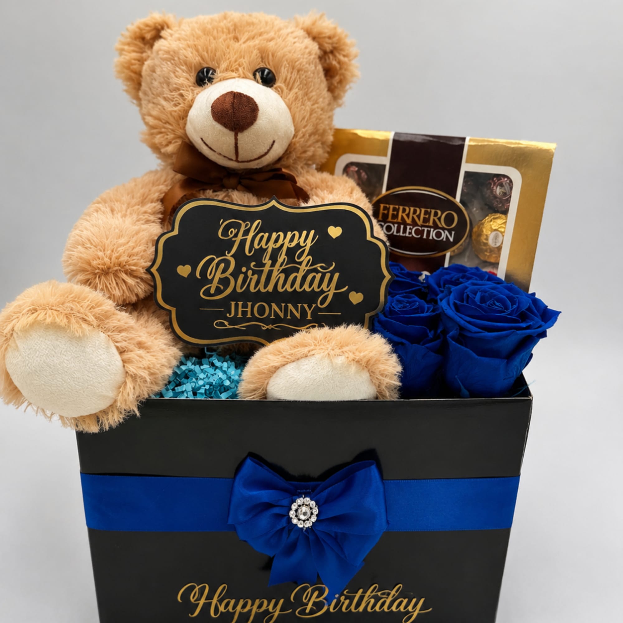 Teddy bear gift box with blue roses and chocolates
