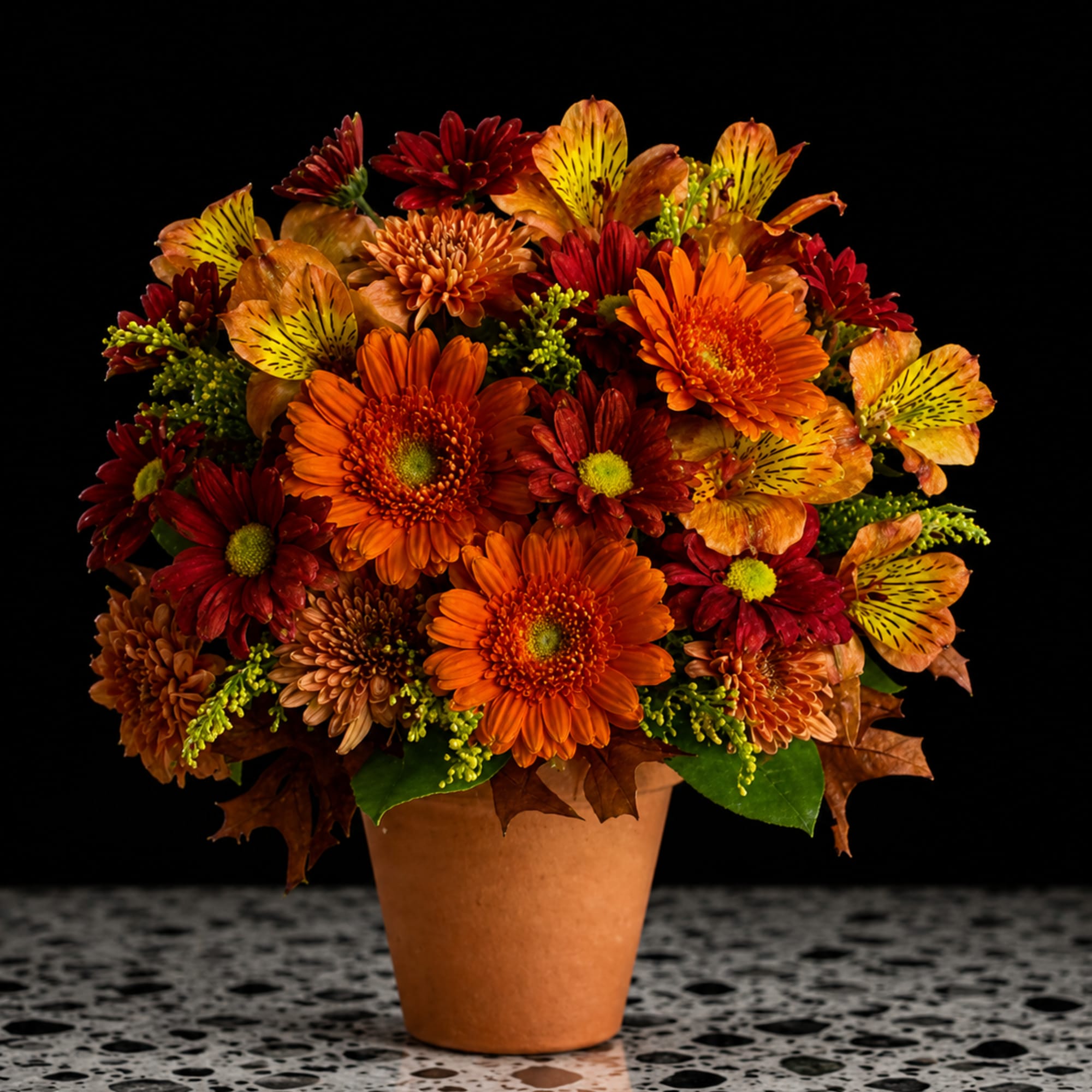 A lively harvest of orange, red and golden blooms makes this fall