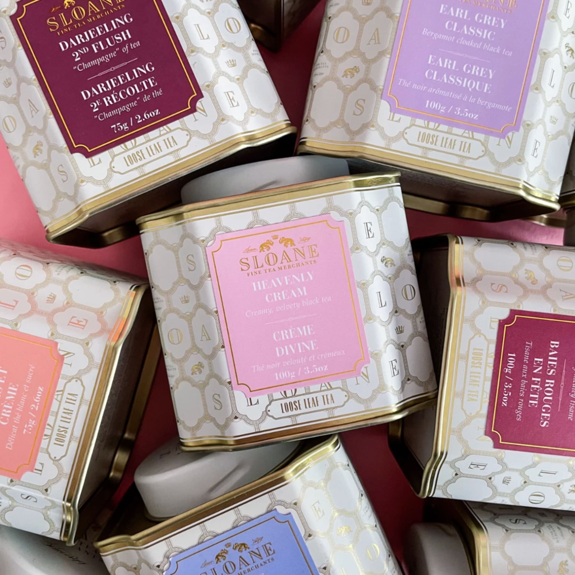 Assorted decorative tins of loose leaf tea stacked together