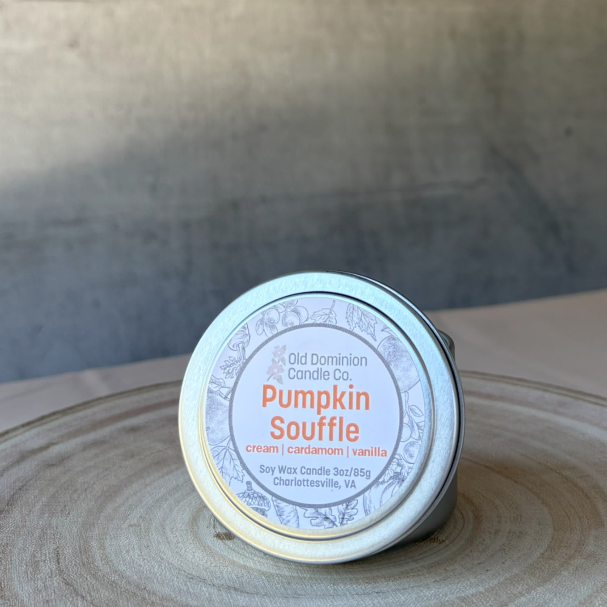Pumpkin Souffle soy wax candle in a small metal tin