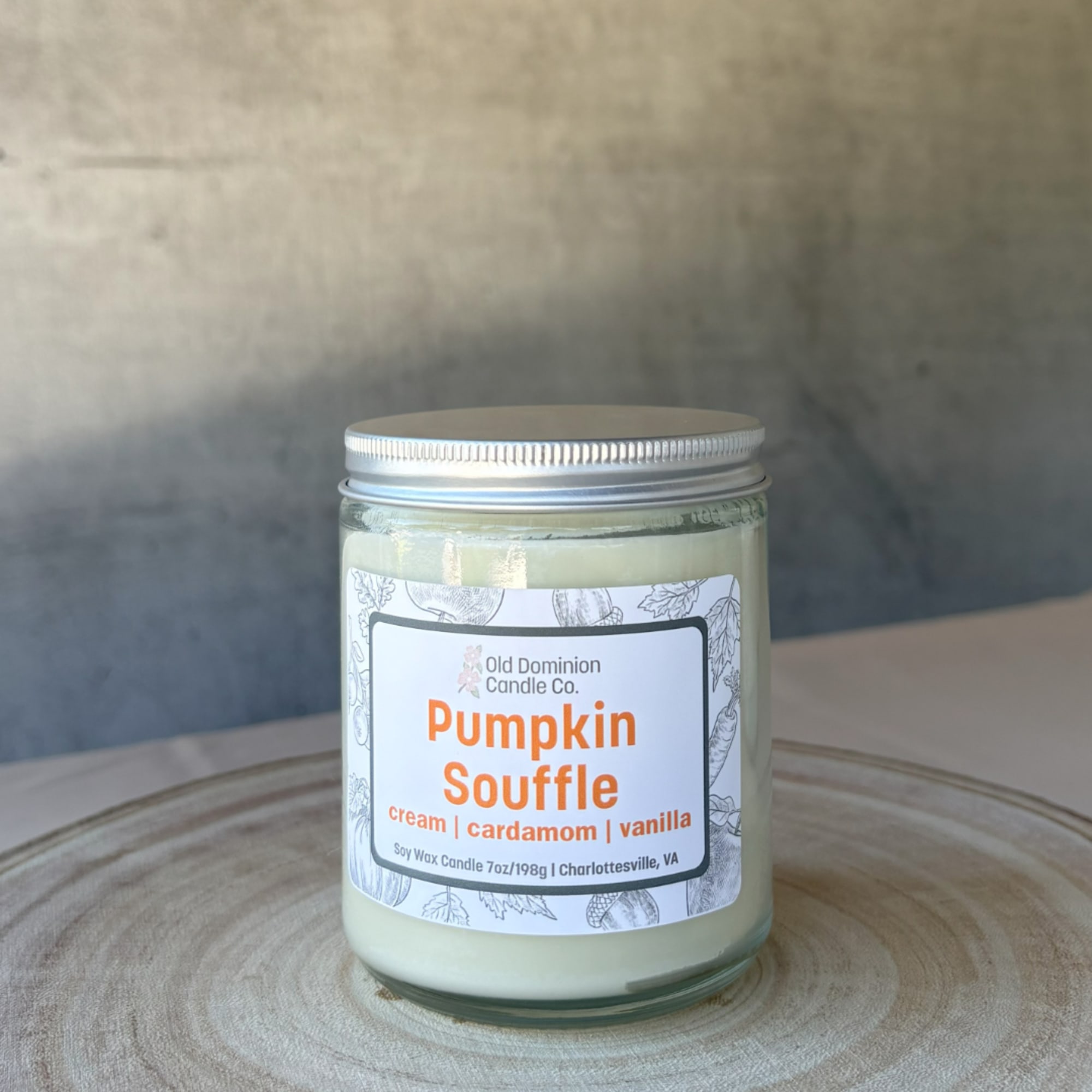 Pumpkin Souffle candle in a glass jar with a silver lid