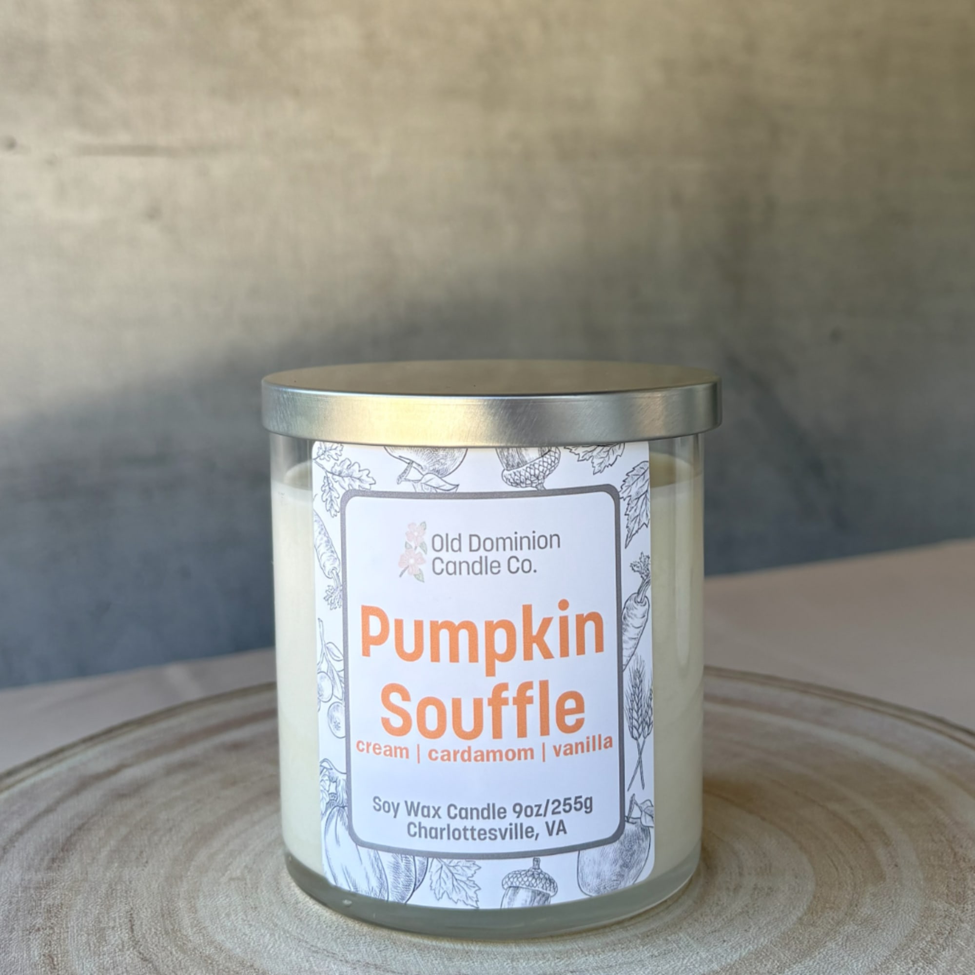 Pumpkin Souffle soy candle in a glass jar with a metal lid