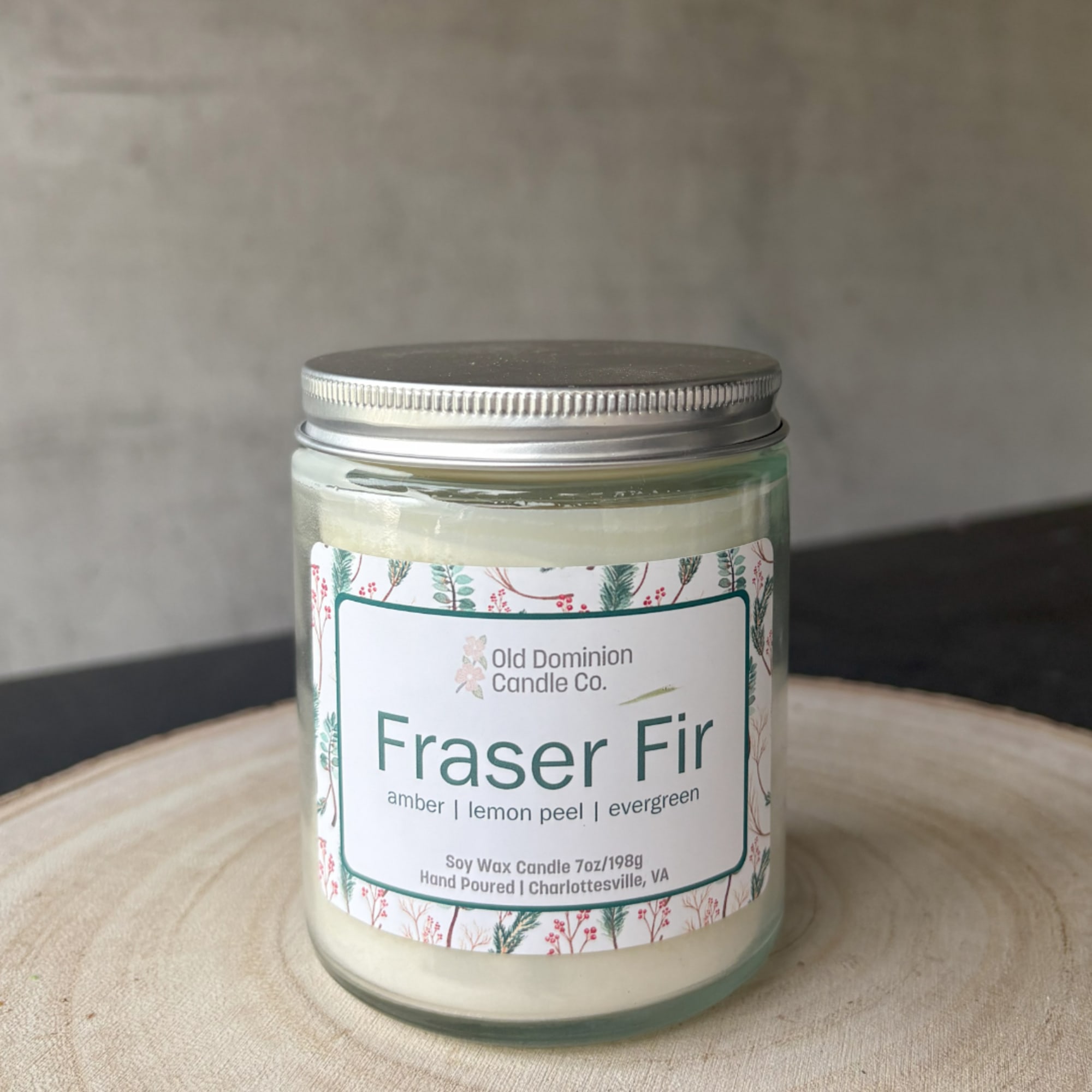 Fraser Fir scented candle in a glass jar with a metal lid