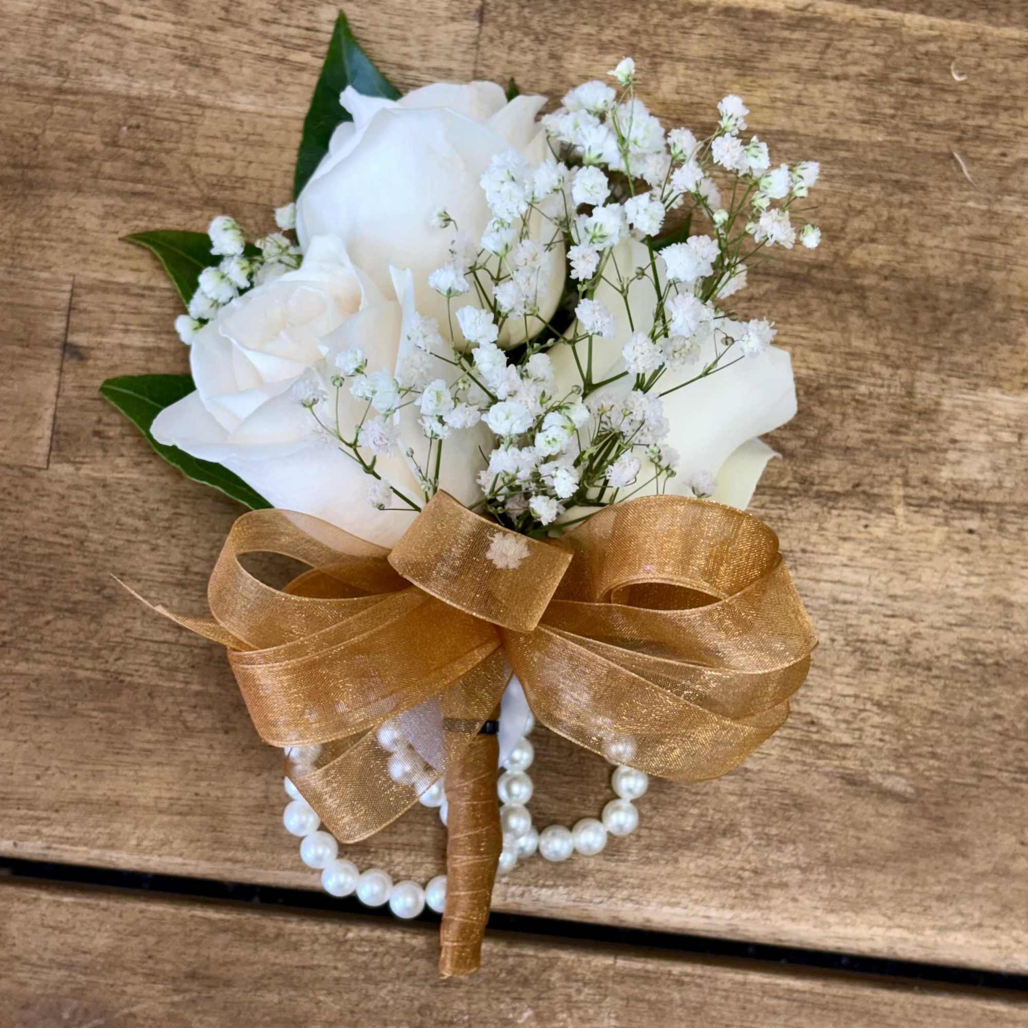 Elegant wrist corsages handcrafted with premium roses and lush foliage. Ideal for