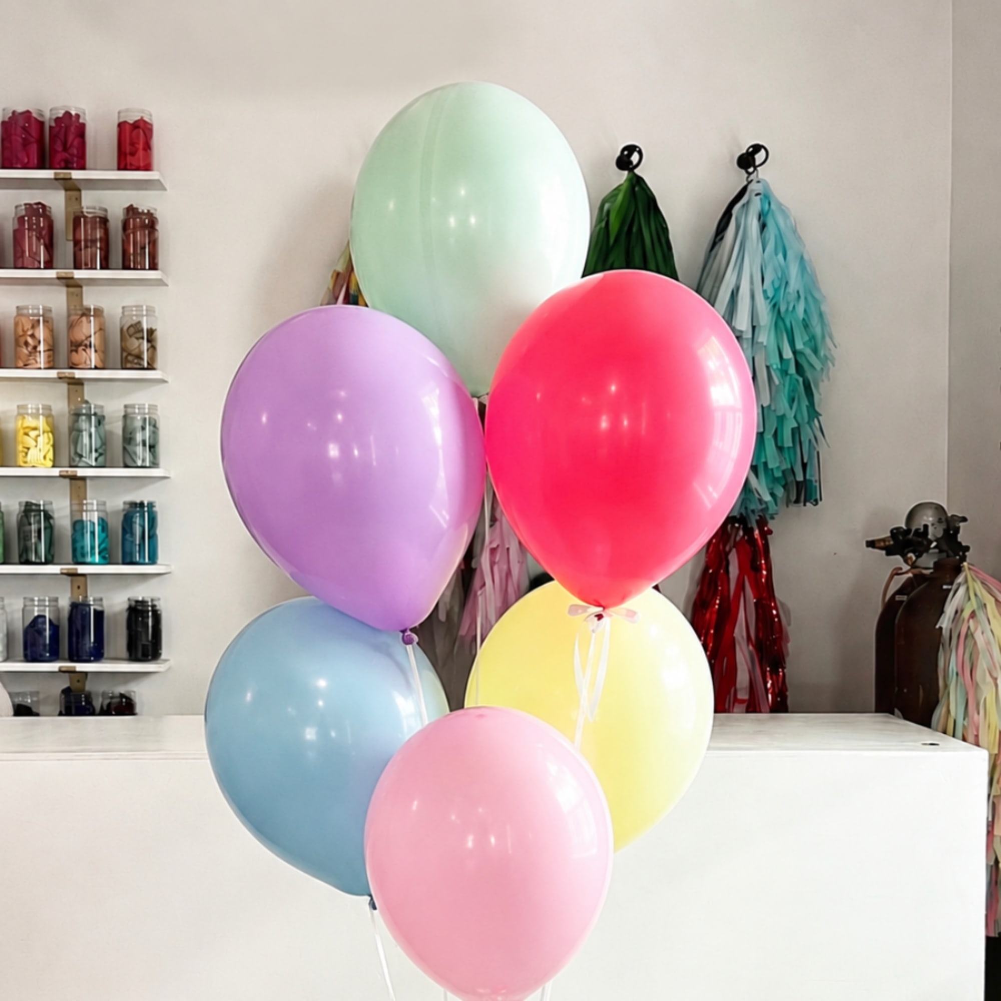Cluster of pastel balloons in a shop interior