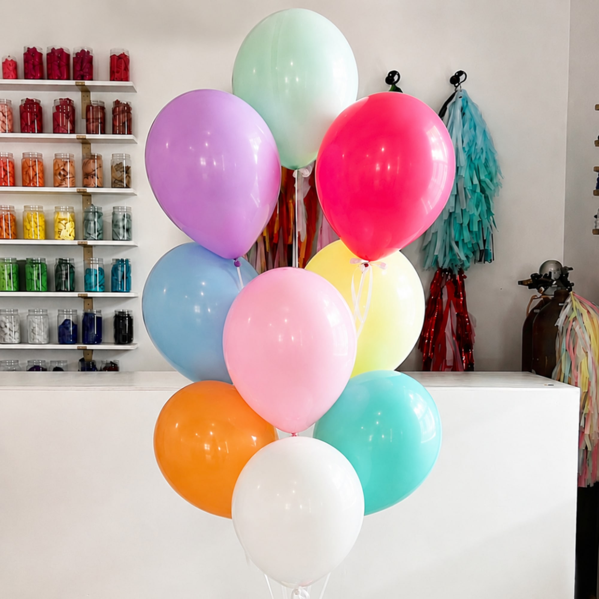 Cluster of colorful balloons in a shop interior