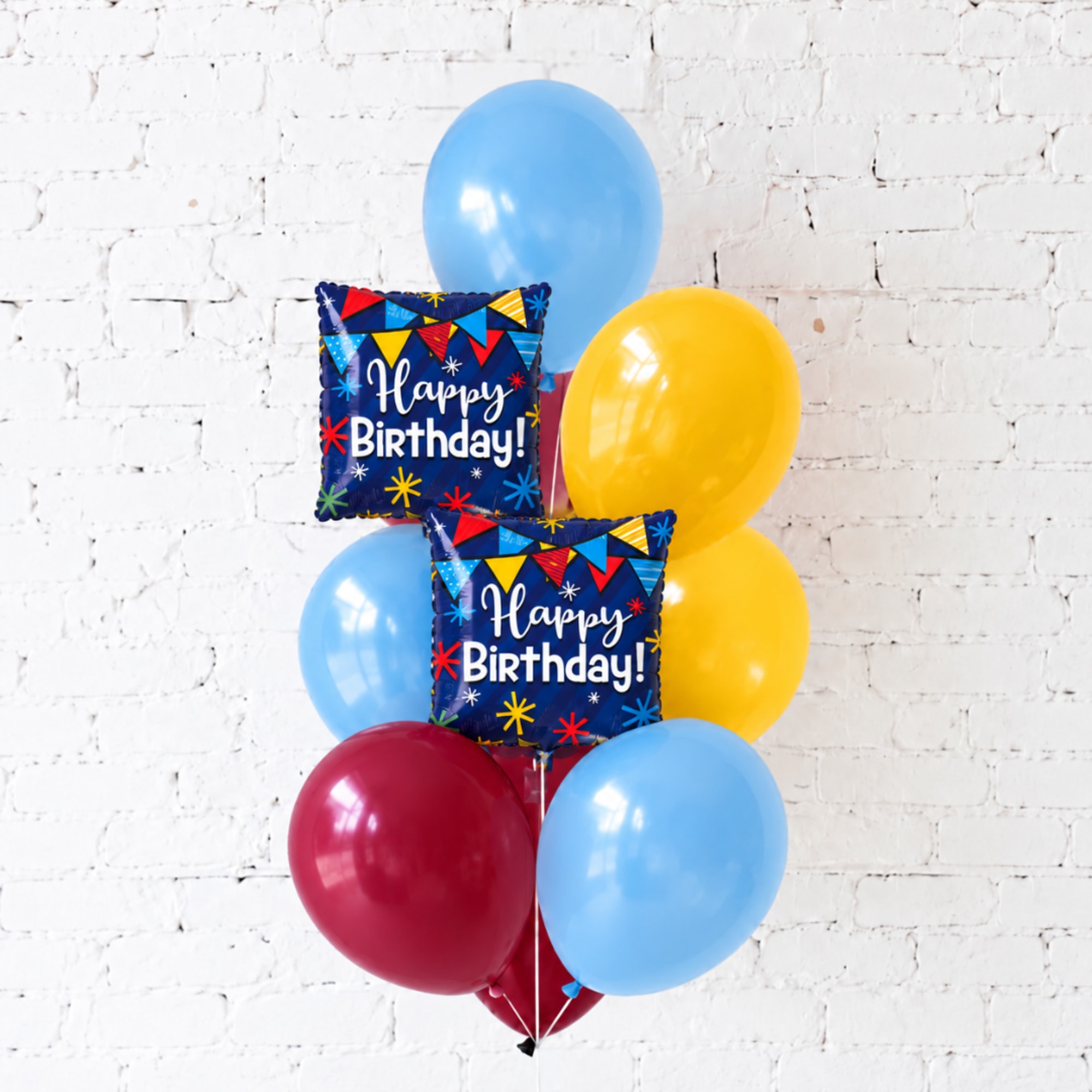 Birthday balloon bouquet with two square Happy Birthday balloons and colorful latex balloons