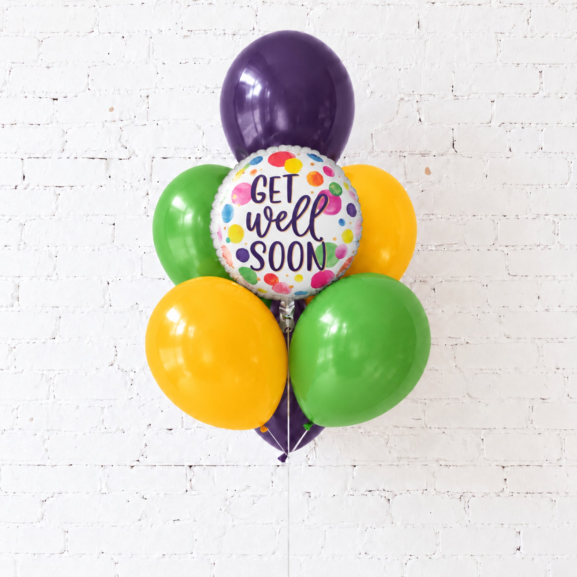 Cluster of colorful balloons with a "Get Well Soon" balloon
