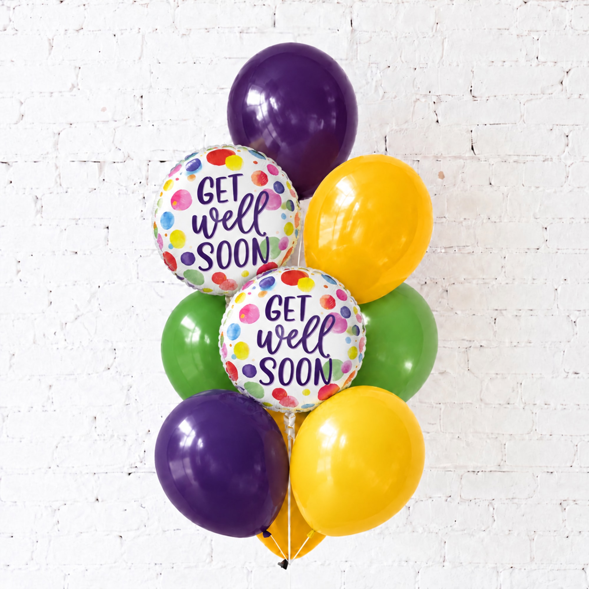 Cluster of purple, yellow, and green balloons with two "Get Well Soon" balloons