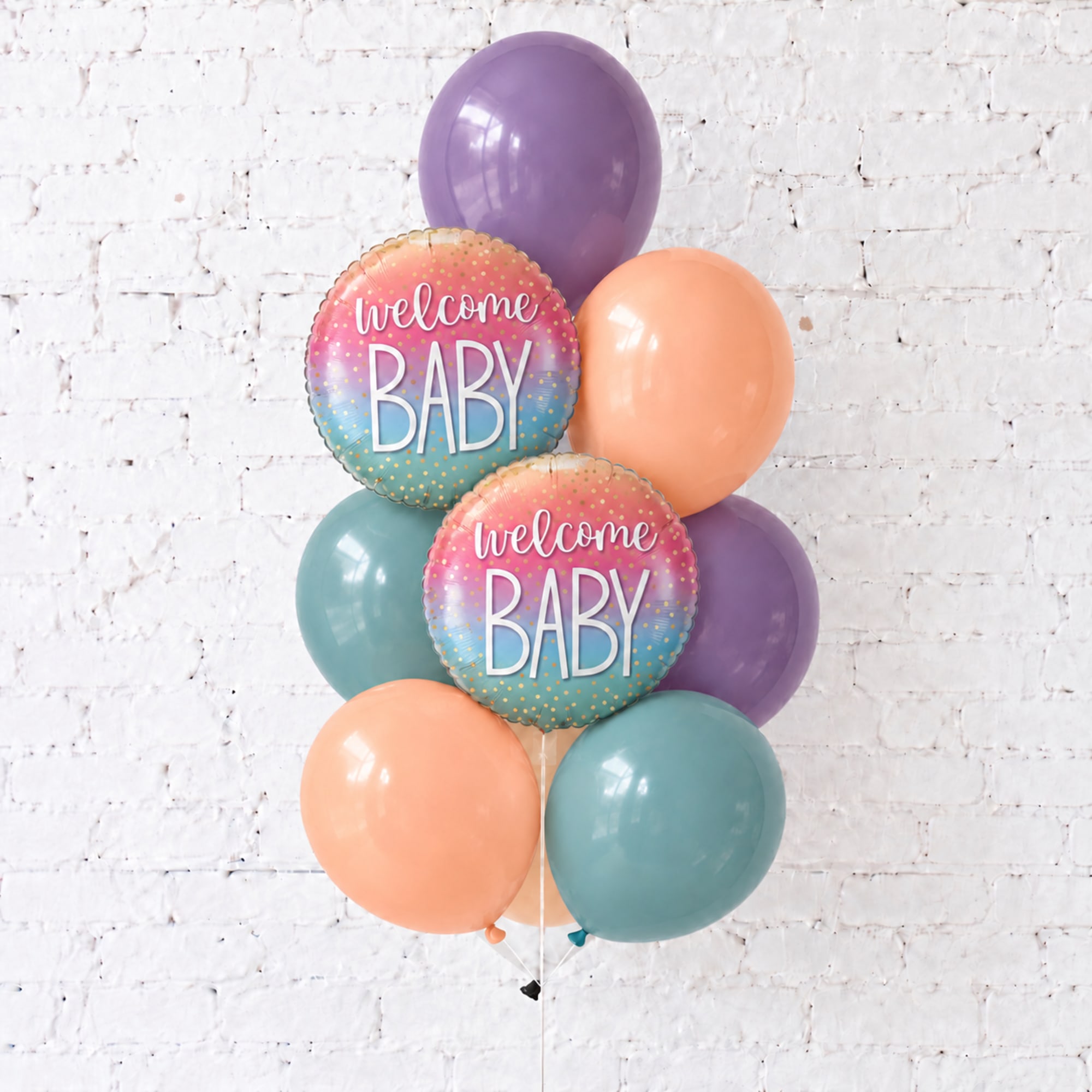Pastel baby shower balloon bouquet with two welcome baby foil balloons