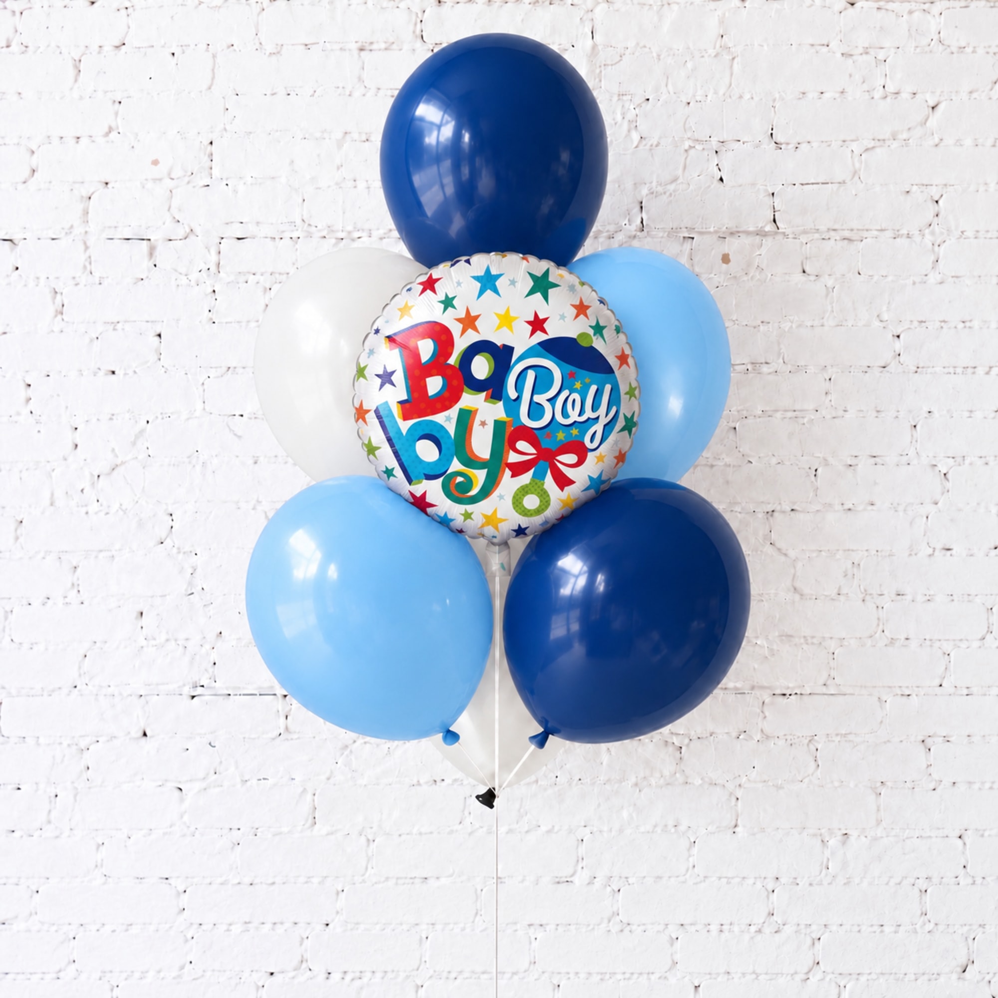 Blue and white baby boy balloon bouquet with a round foil balloon