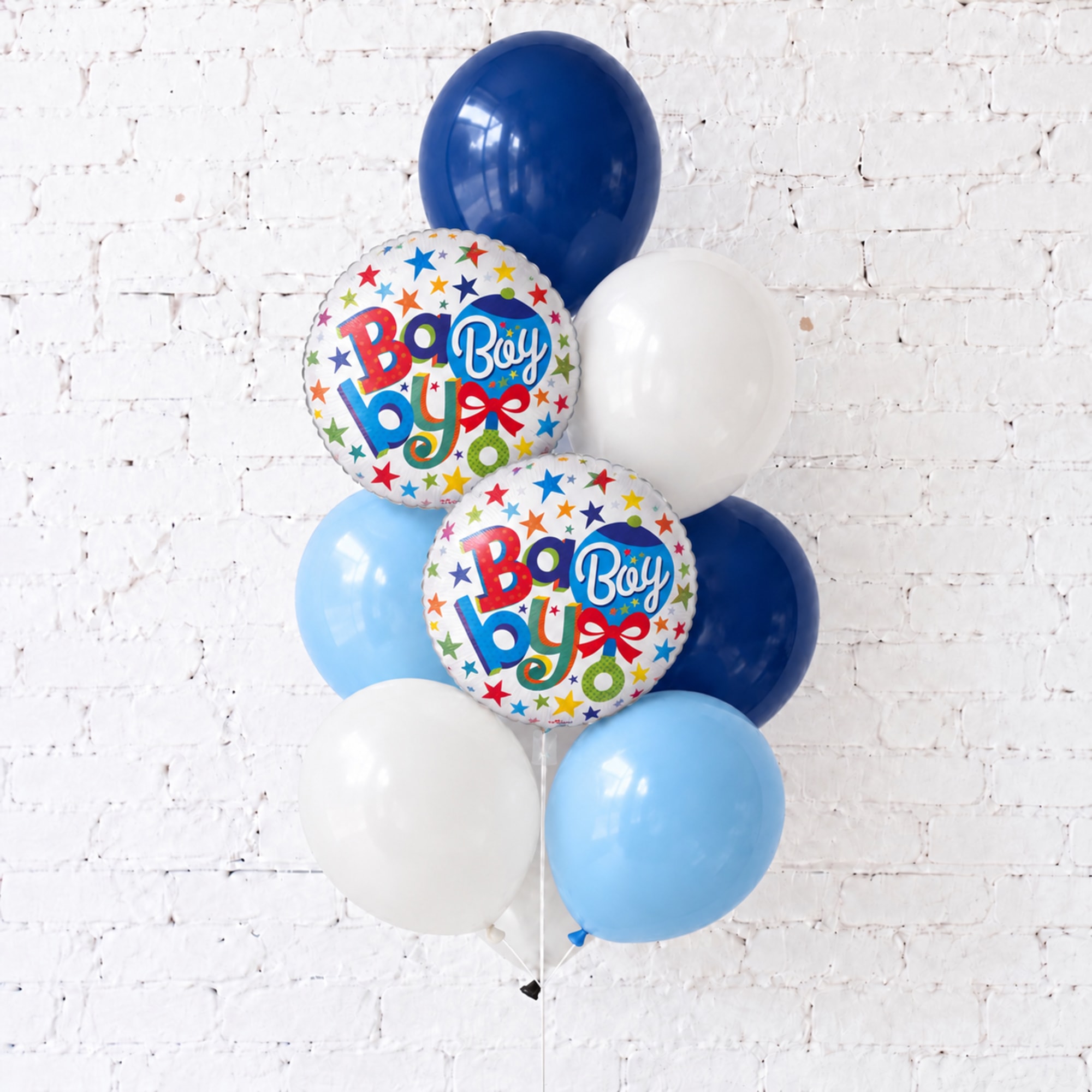 Cluster of blue and white balloons with two "Baby Boy" balloons