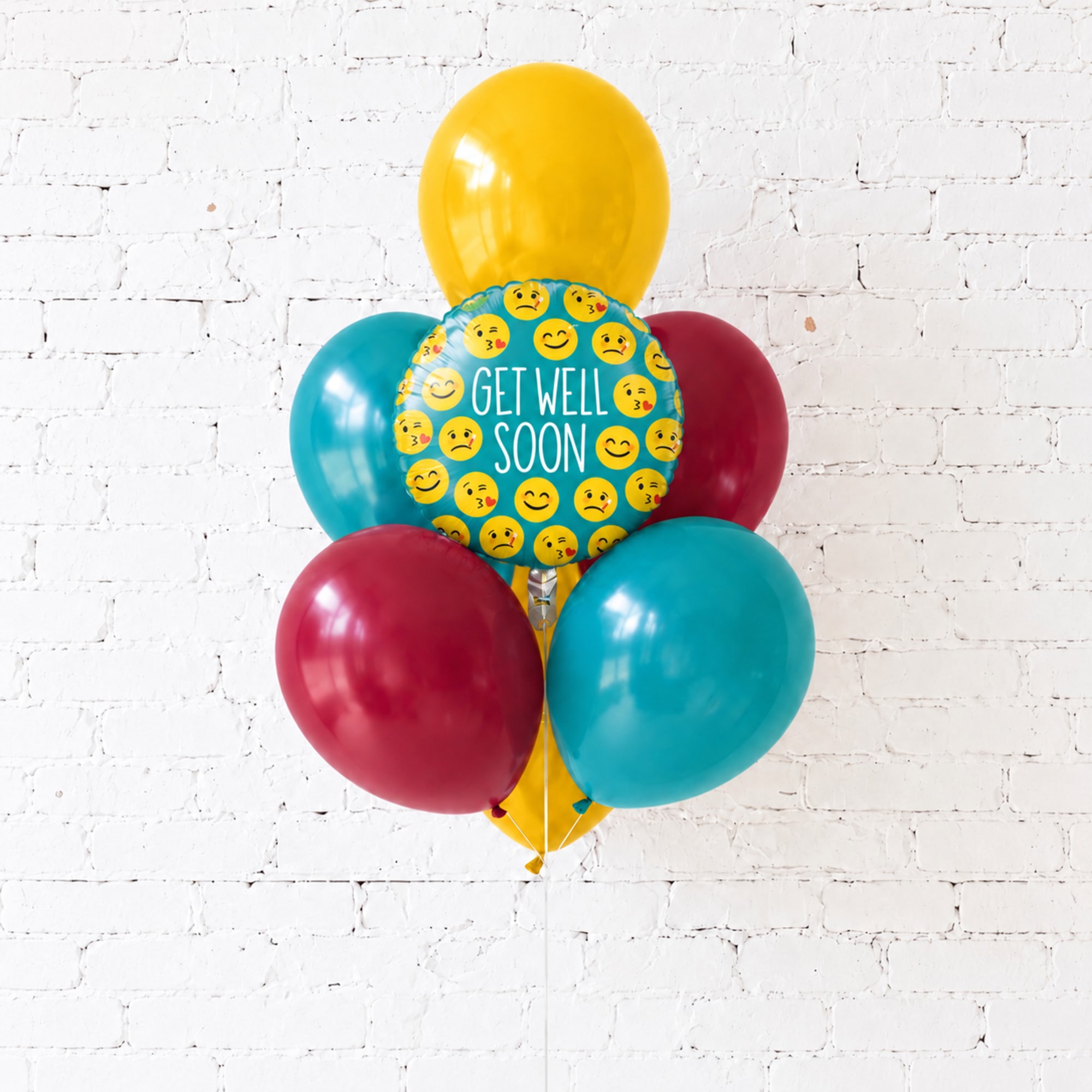 Cluster of colorful balloons with a "Get Well Soon" balloon in front