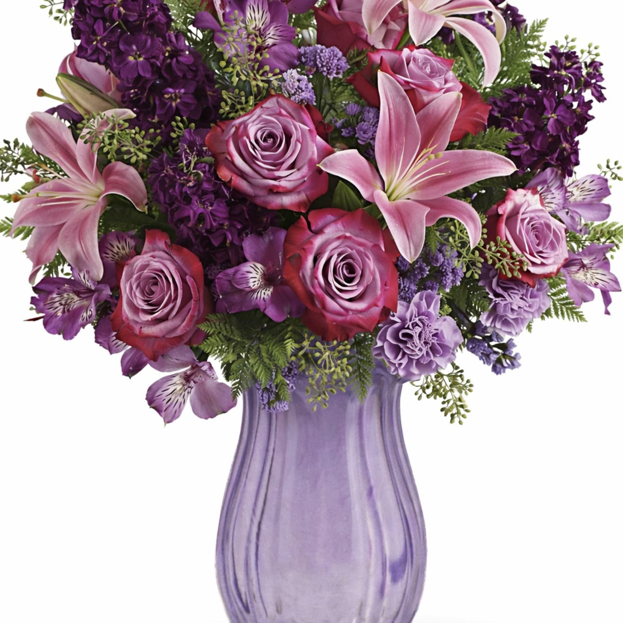 This regal arrangement of lavender roses and pink lilies is naturally breathtaking.