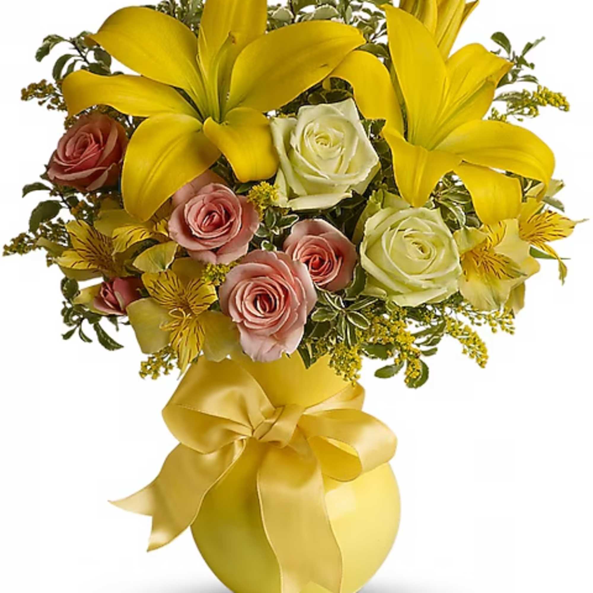 Yellow lilies and pink roses in a yellow vase with a ribbon bow